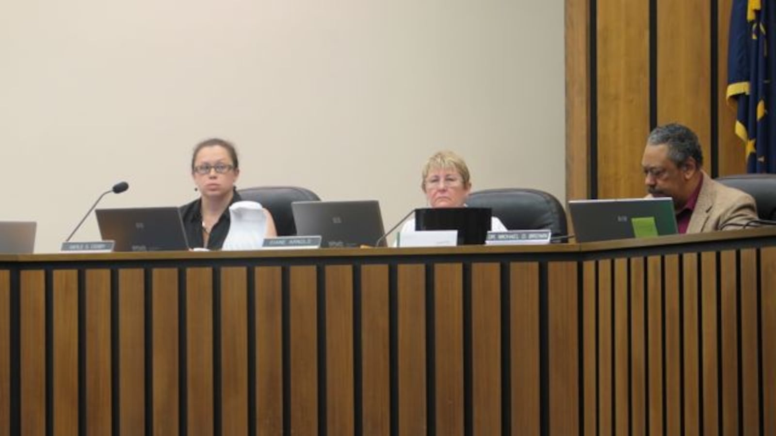 Indianapolis Public School Board members Gayle Cosby, Diane Arnold and Michael Brown discuss district issues at a July school board meeting.