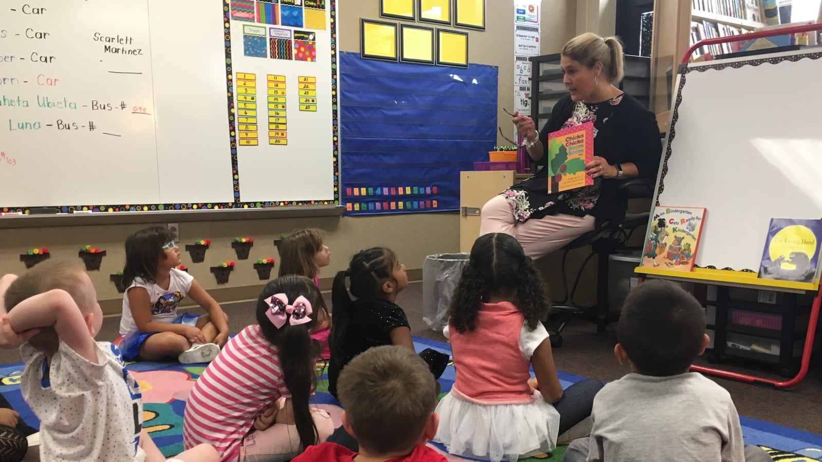 Stout Field Elementary School kindergarten teacher Mandy Sequin reads "Chicka Chicka Boom Boom" to her class on the first day of school.