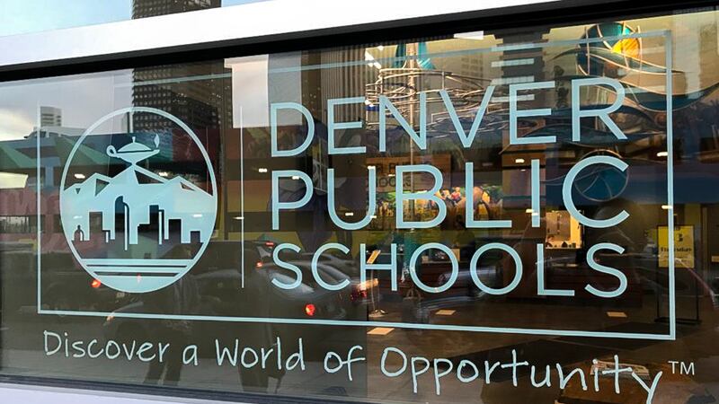 Denver Public Schools’ logo, with “Discover a World of Opportunity” imprinted on glass.