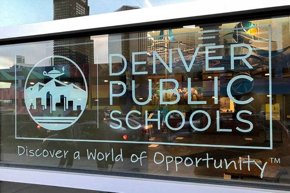 Denver Public Schools’ logo, with “Discover a World of Opportunity” imprinted on glass.