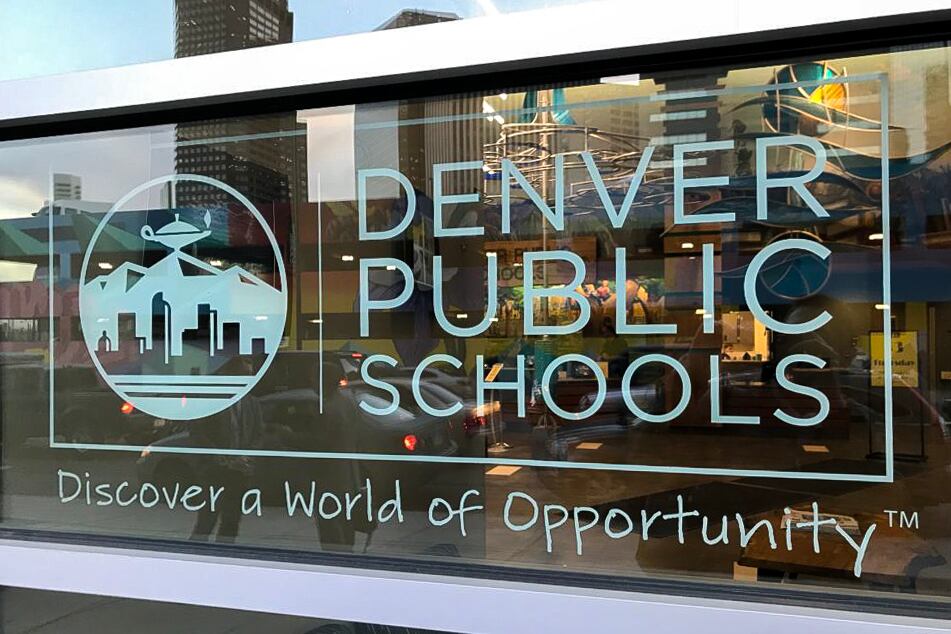 Denver Public Schools’ logo, with “Discover a World of Opportunity” imprinted on glass.