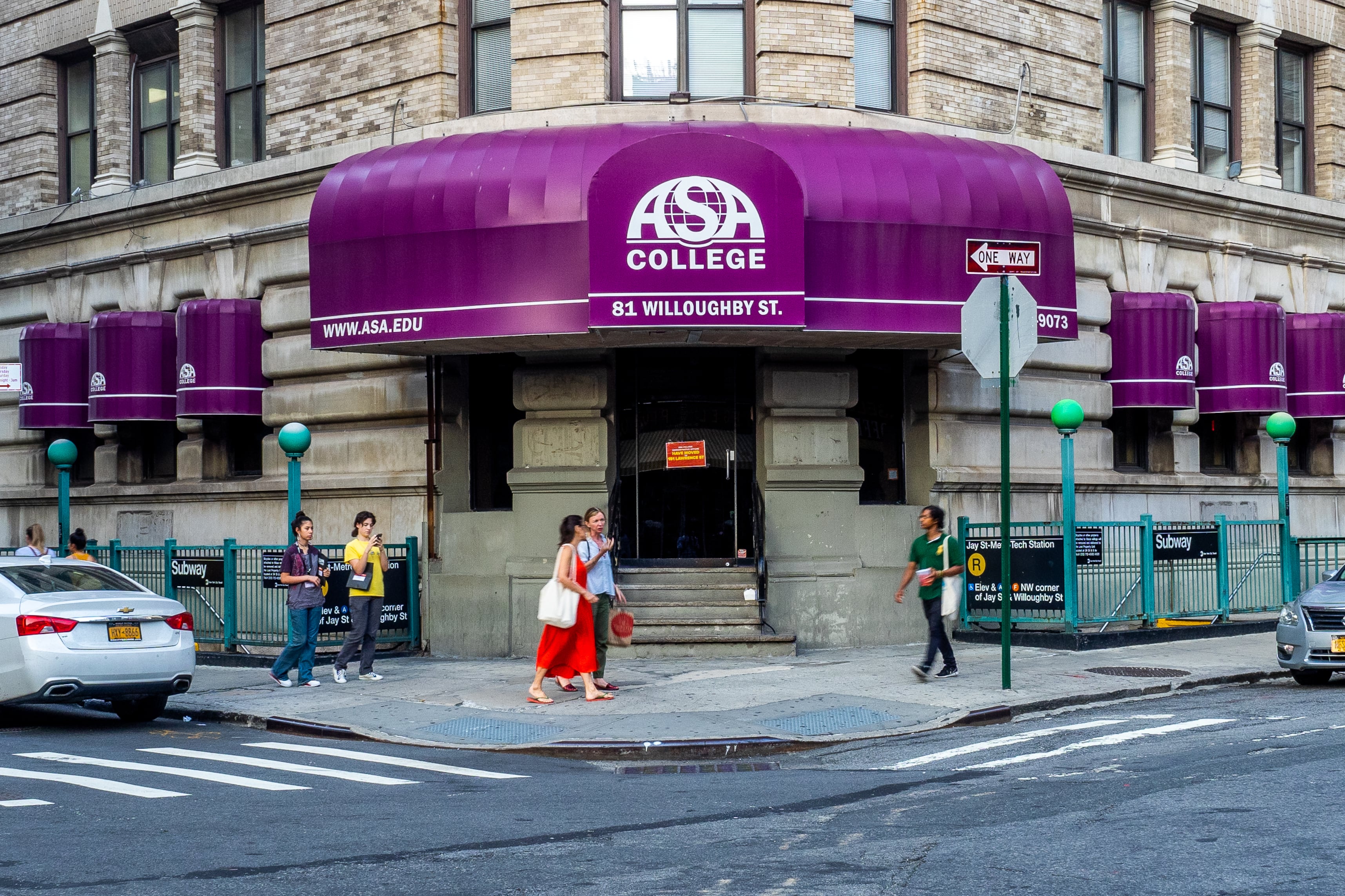 A building with purple sign for ASA college. 