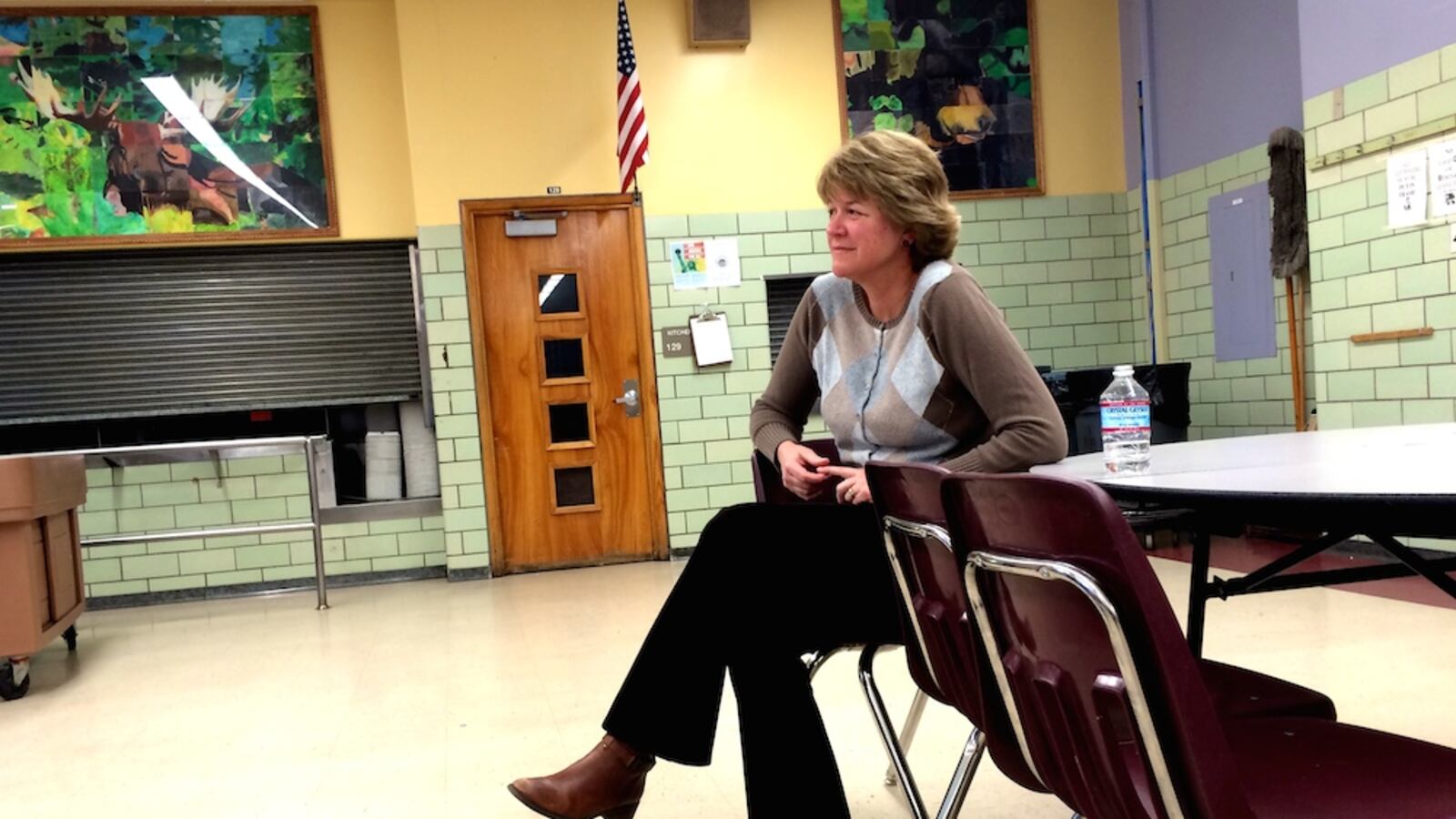 Anne Rowe, vice president of the Denver Public Schools Board of Education, sits on the sidelines during a March town hall meeting at Merrill Middle School on The Denver Plan. Rowe has led the board's work on updating the district's strategic document.