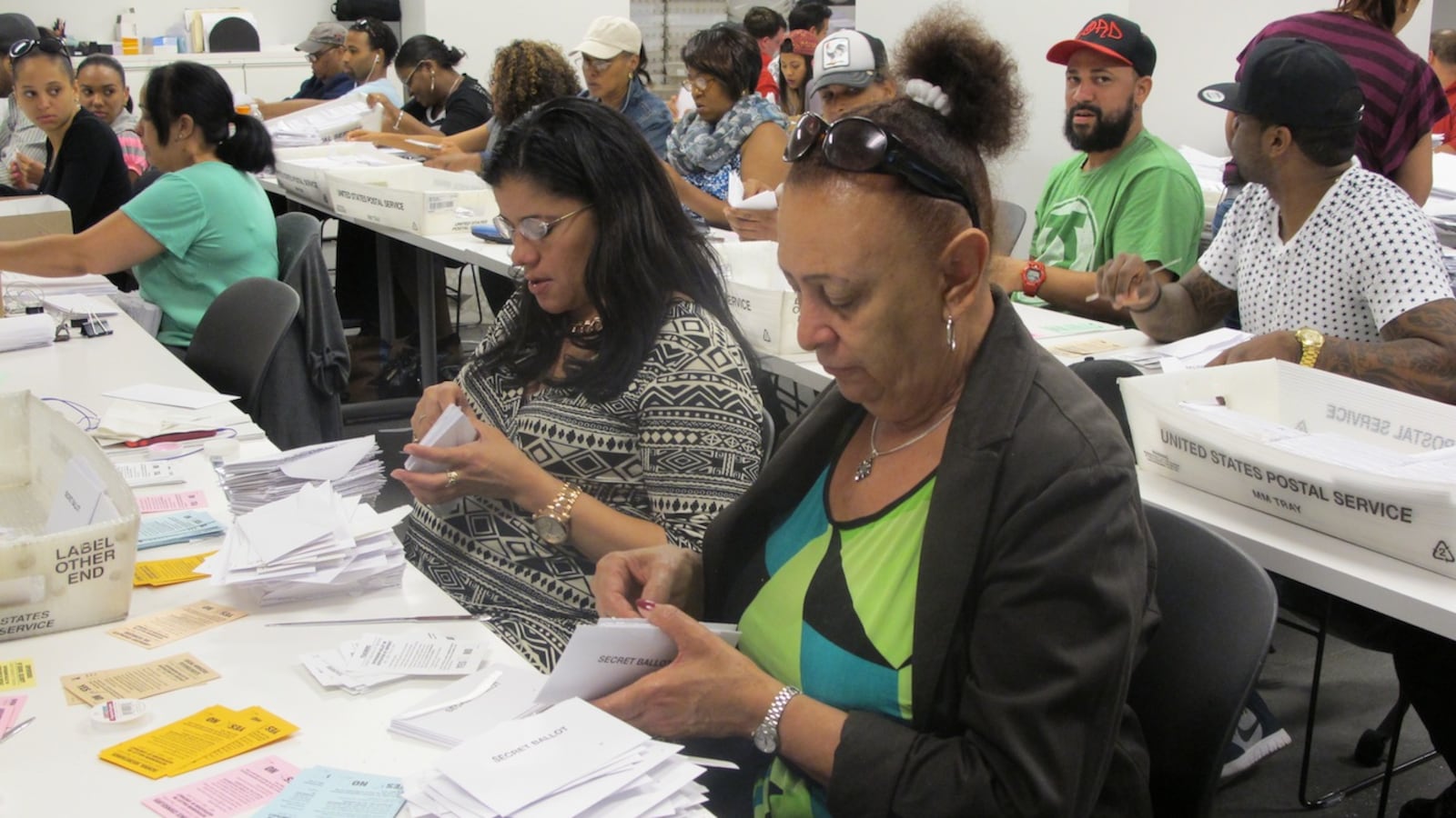Ballot counters sort and scan votes on the United Federation of Teachers contract.