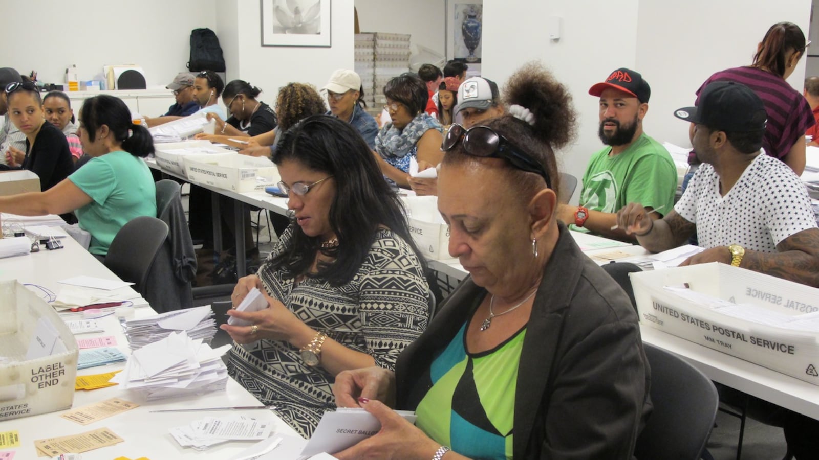 Ballot counters sort and scan votes on the United Federation of Teachers contract.