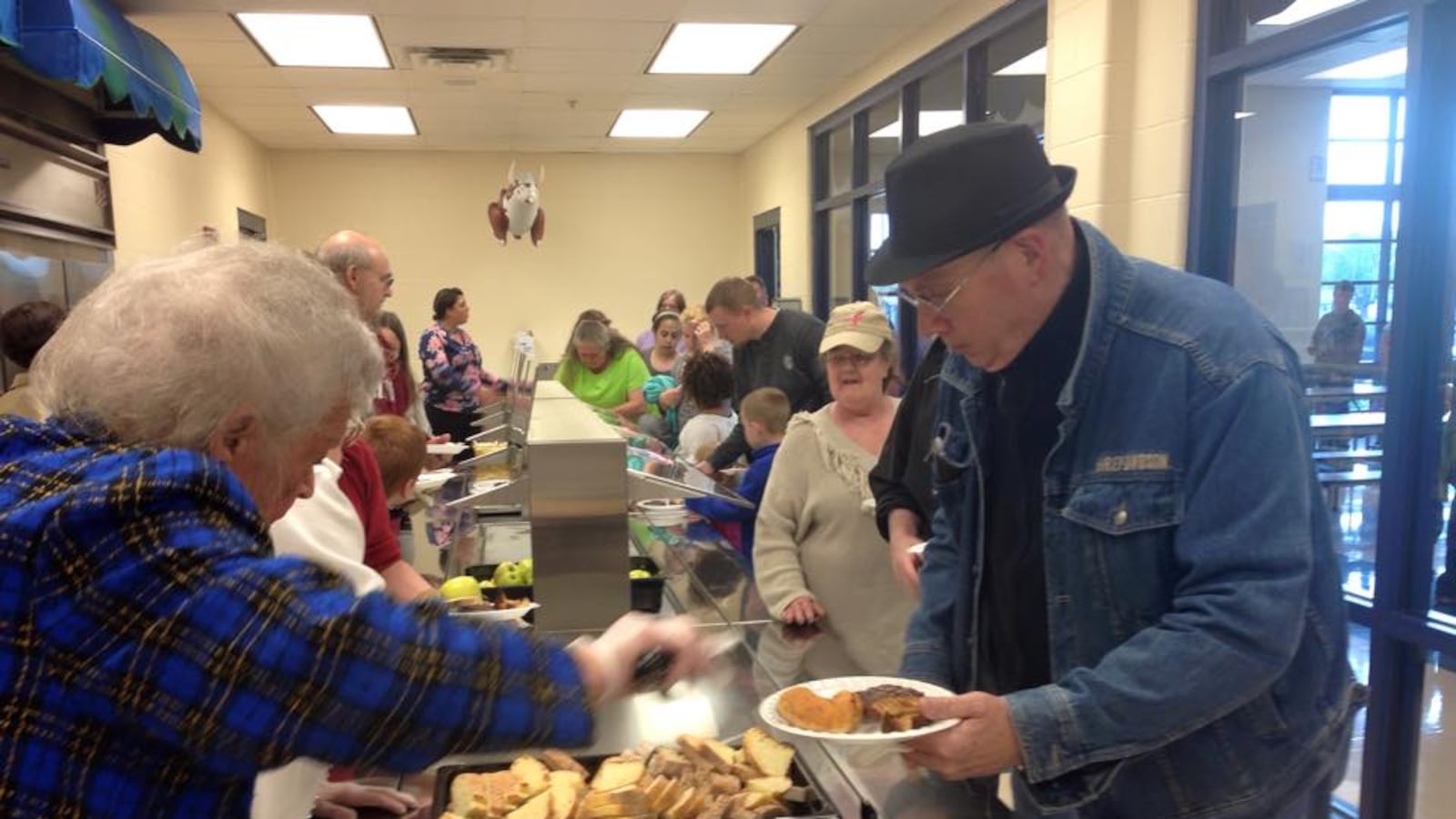 Goodwin seniors serve Tuesday lunch at the center. Next door, Stephen Decatur Elementary School also provides free dinners each week. The program is part of how the district connects with the people and organizations around them.