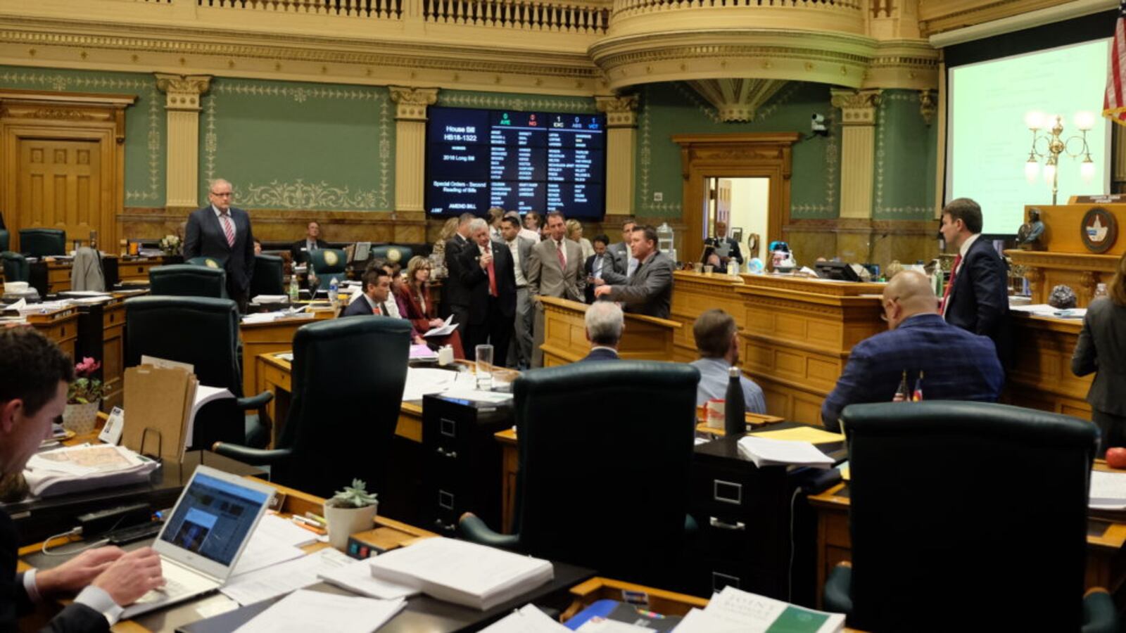 House Minority Leader Patrick Neville speaks in support of more money for school security measures during the 2018-19 budget debate. State Rep. Alec Garnett, right, watches. (Erica Meltzer/Chalkbeat)