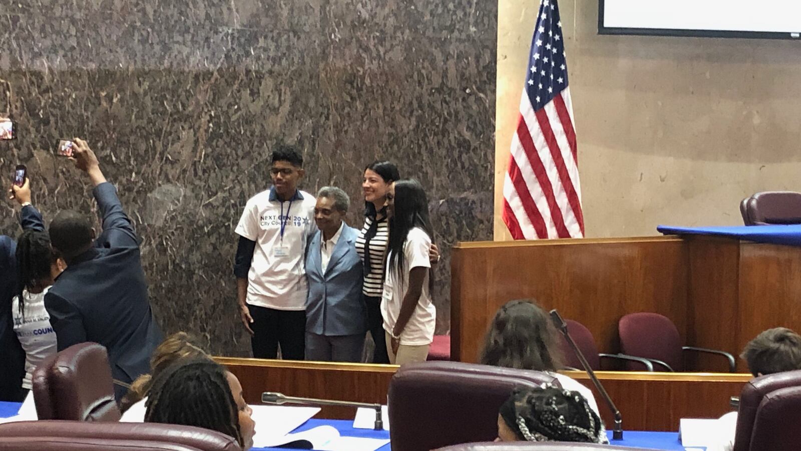 Lori Lightfoot addressed high school students and took photos with them in her first appearance at the Chicago City Council on May 23, 2019.