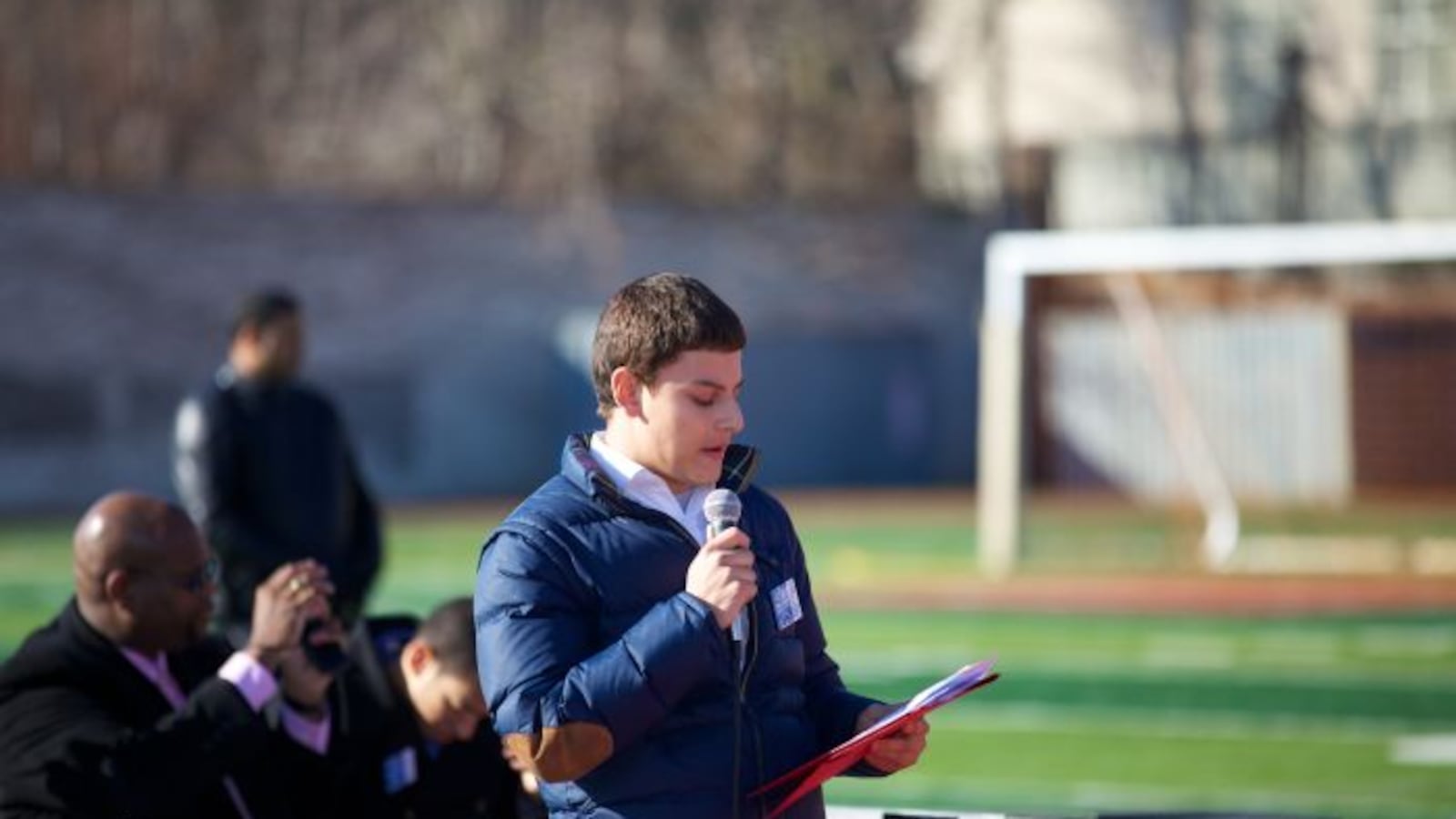Justin Zemser speaks to students at a College March while in high school.