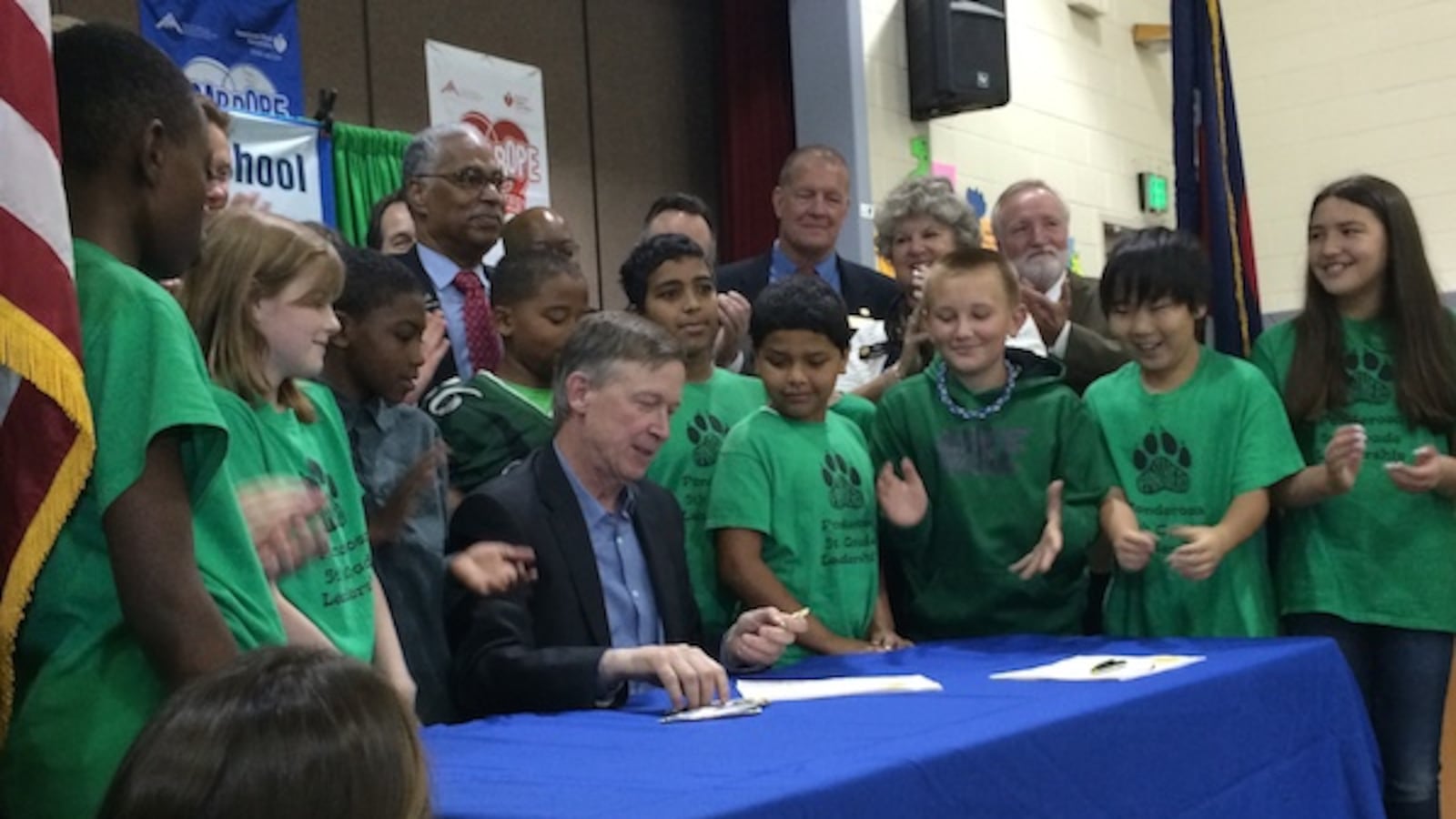 Gov. John Hickenlooper was surrounded by Ponderosa Elementary School students as he signed two 2014 K-12 funding bills.