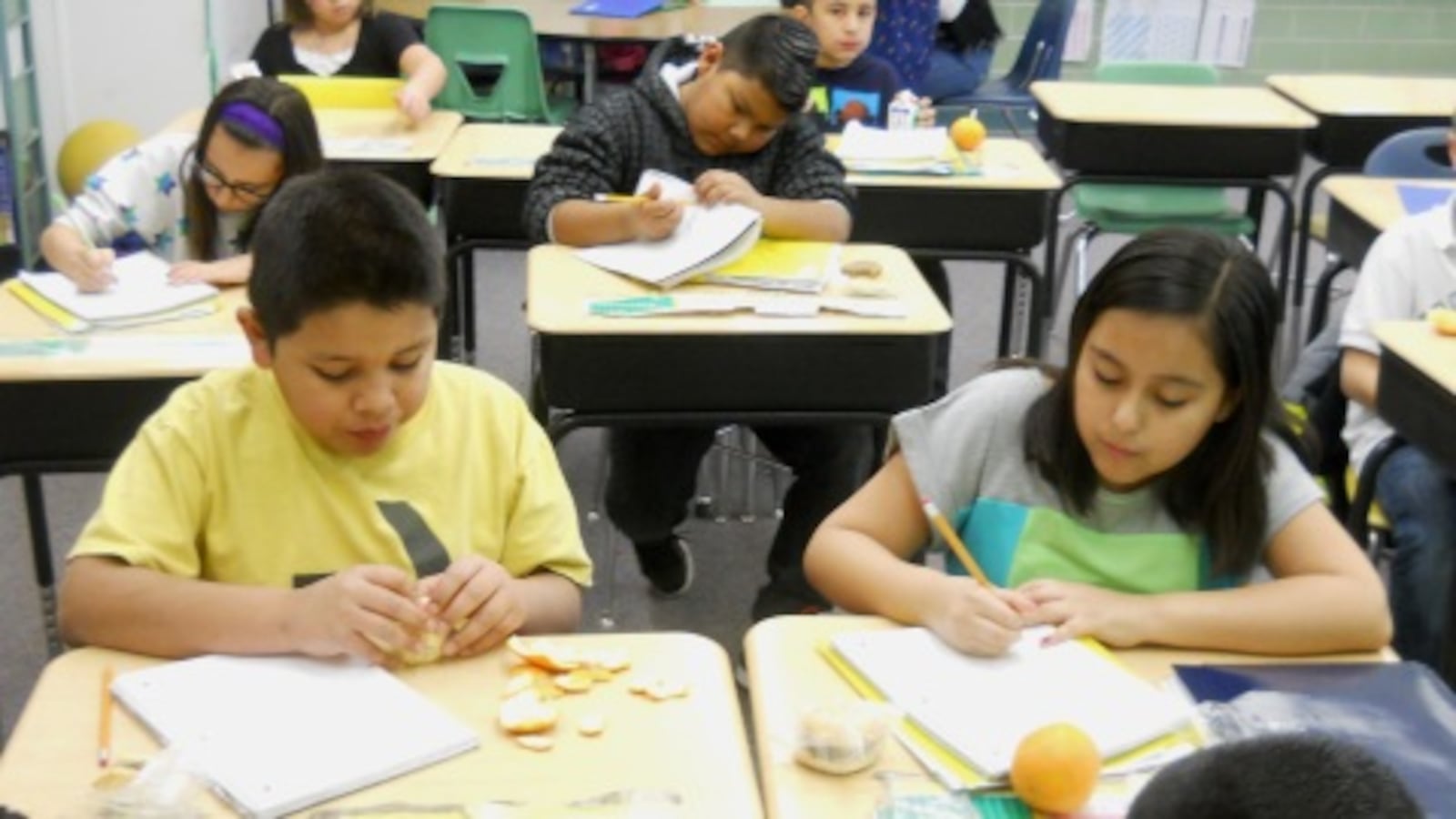 Fourth-graders at Alsup Elementary in Commerce City have breakfast in the classroom.