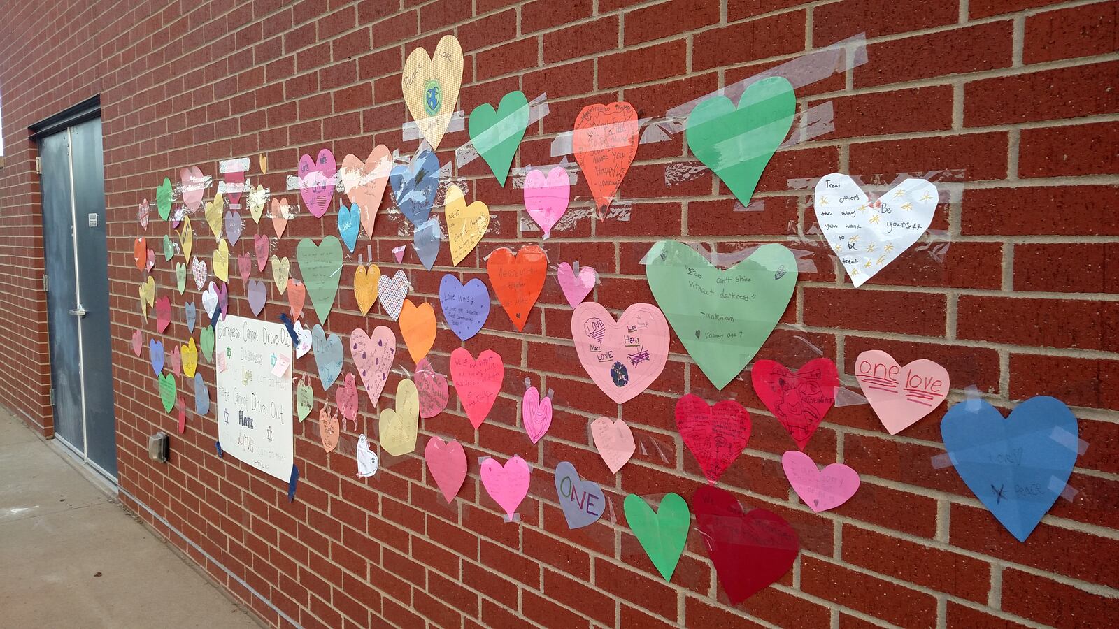 Messages of love that replaced graffiti at Denver's Isabella Bird Community School.