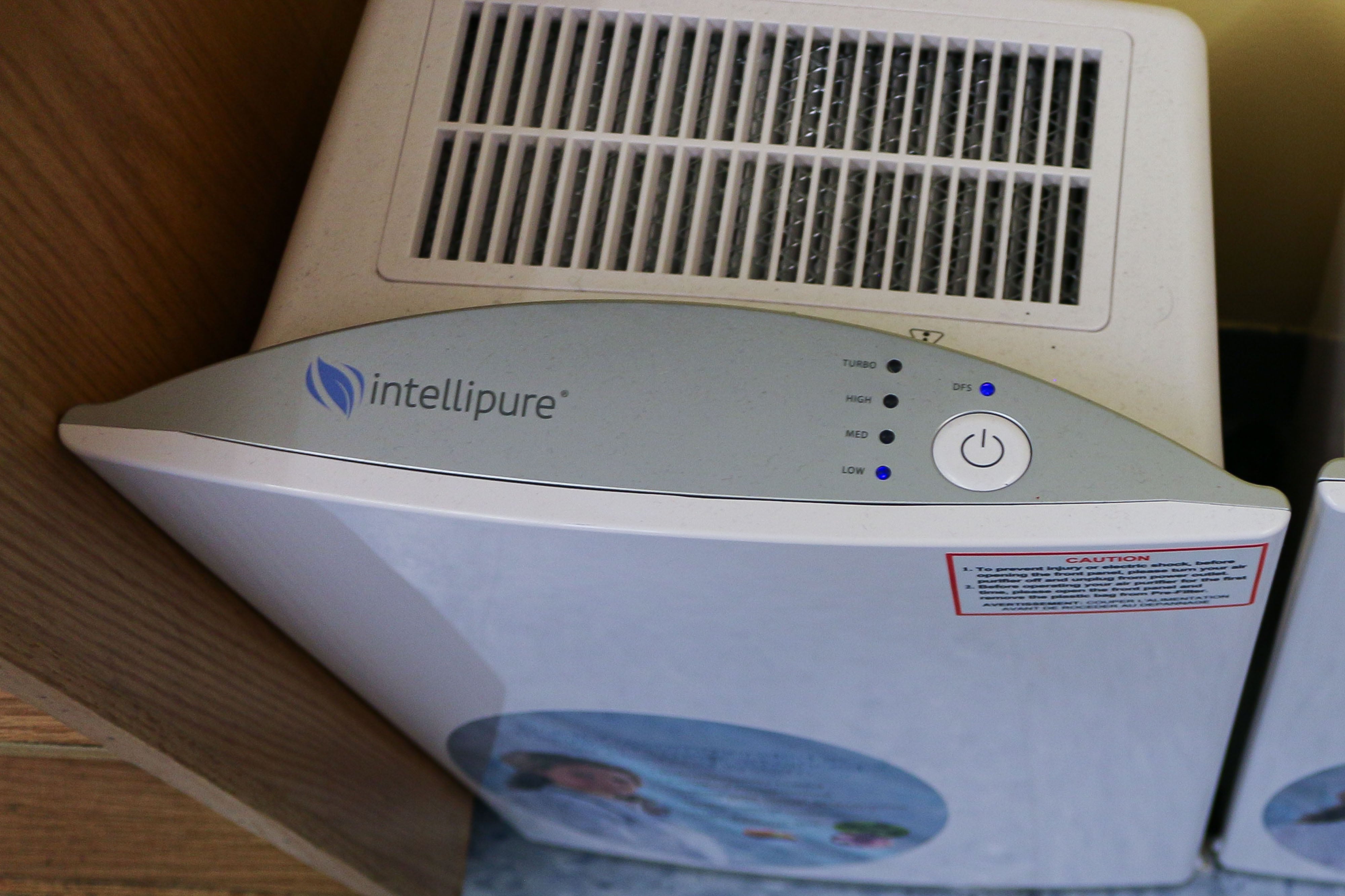 An Intellipure air purifier sits against the wall in a New York City Classroom.