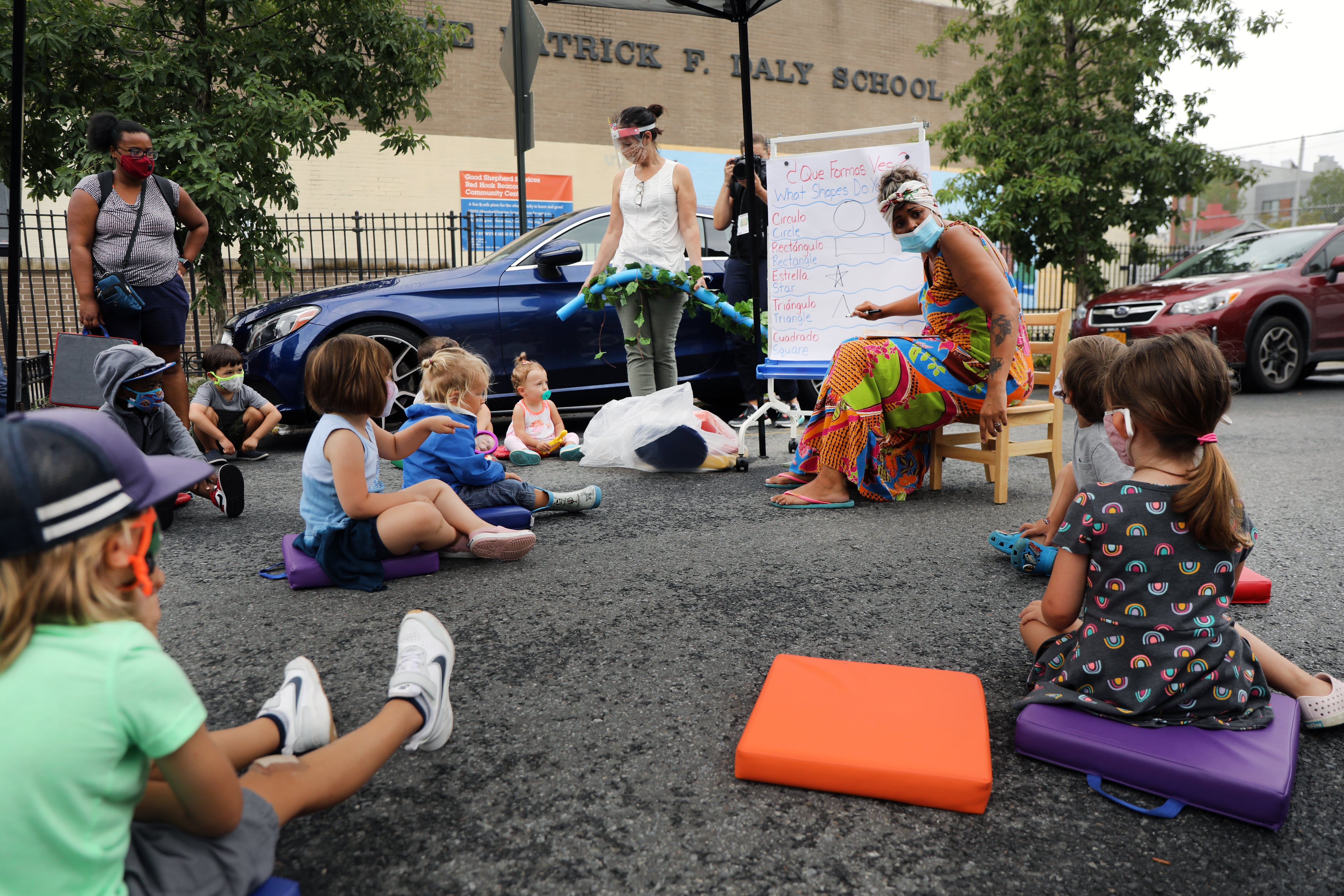 City council members, parents and students participate in an outdoor learning demonstration in front of a public school in the Red Hook neighborhood on September 02, 2020 in the Brooklyn borough of New York City.