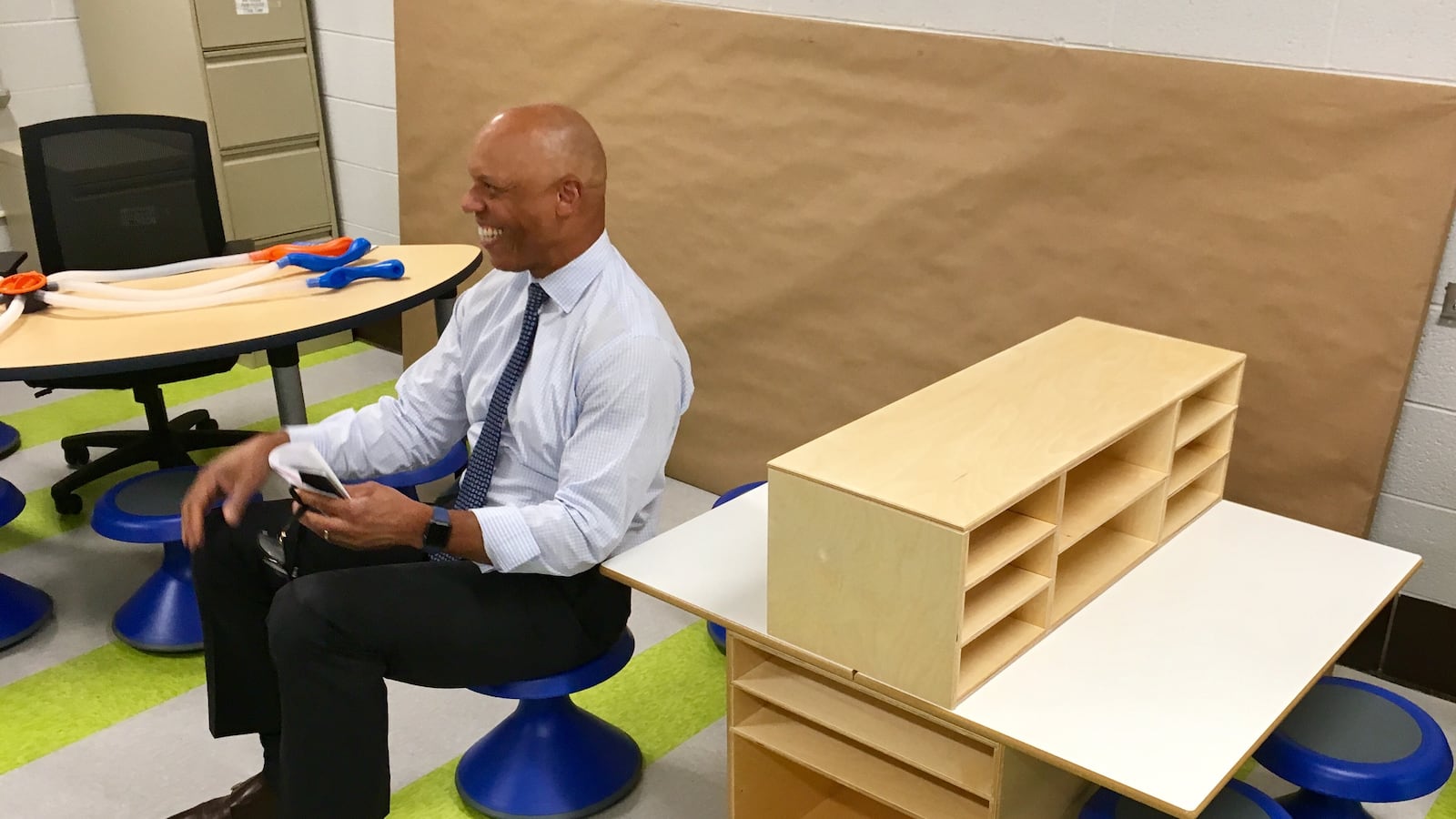 Superintendent William Hite sitting on a wobble seat.