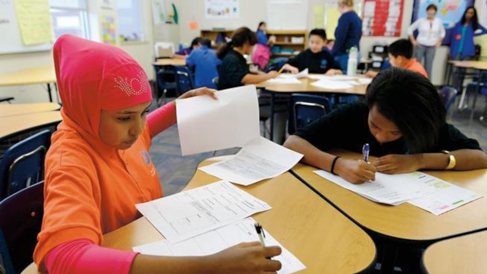 Sixth-graders in Alice Wilcox’s English Language Development class work on their end-of-quarter foreign country research project at Aurora Hills Middle School.