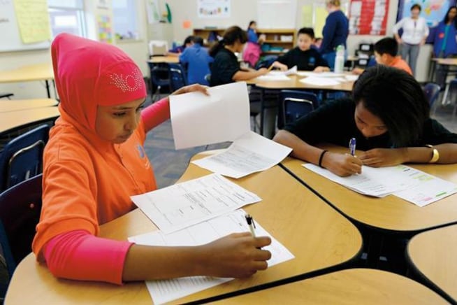 Sixth-graders in Alice Wilcox’s English Language Development class work on their end-of-quarter foreign country research project at Aurora Hills Middle School.