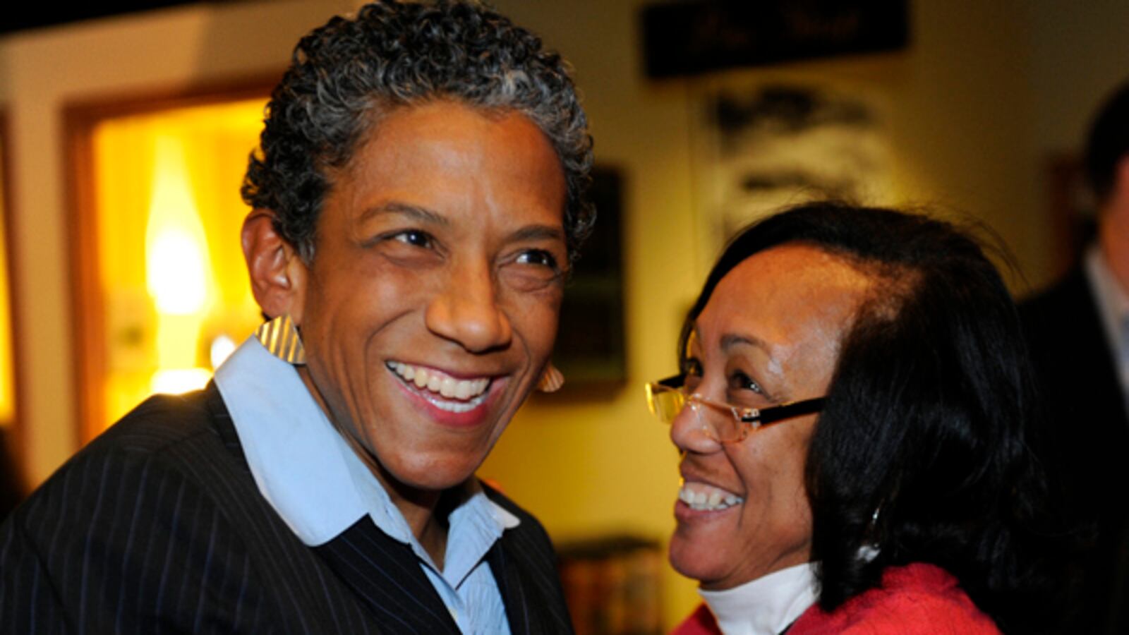 Happy Haynes (left) celebrates her 2011 election to the Denver school board with her sister Khadija.