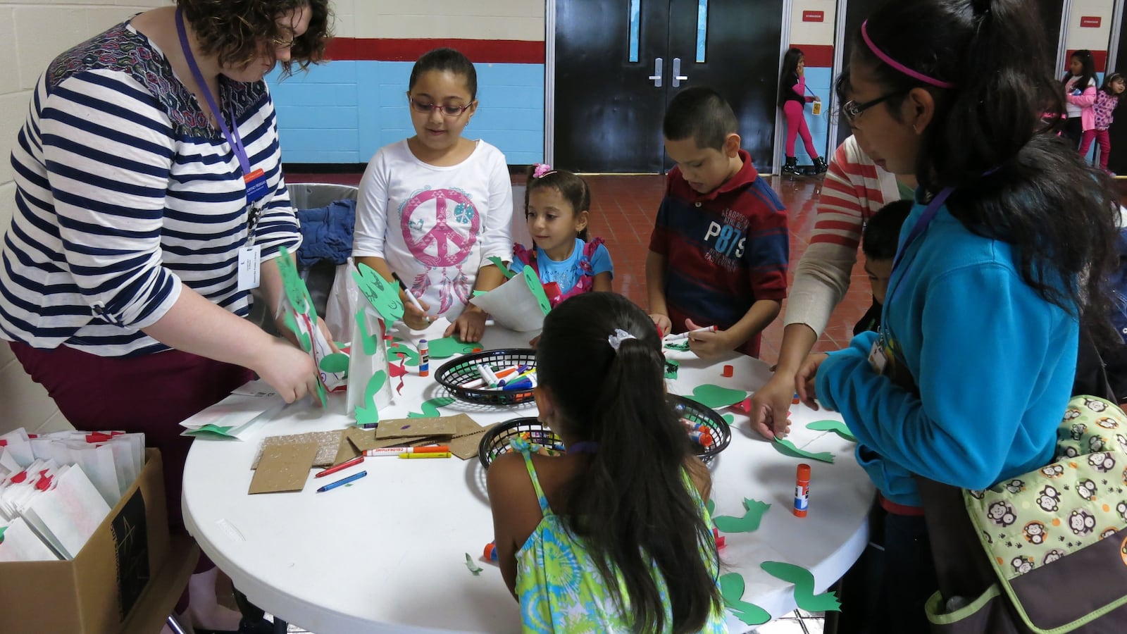 Students participate in a craft at a joint event between Metropolitan Nashville Public Schools and the Nashville Public Library to teach immigrant families about the public library system.