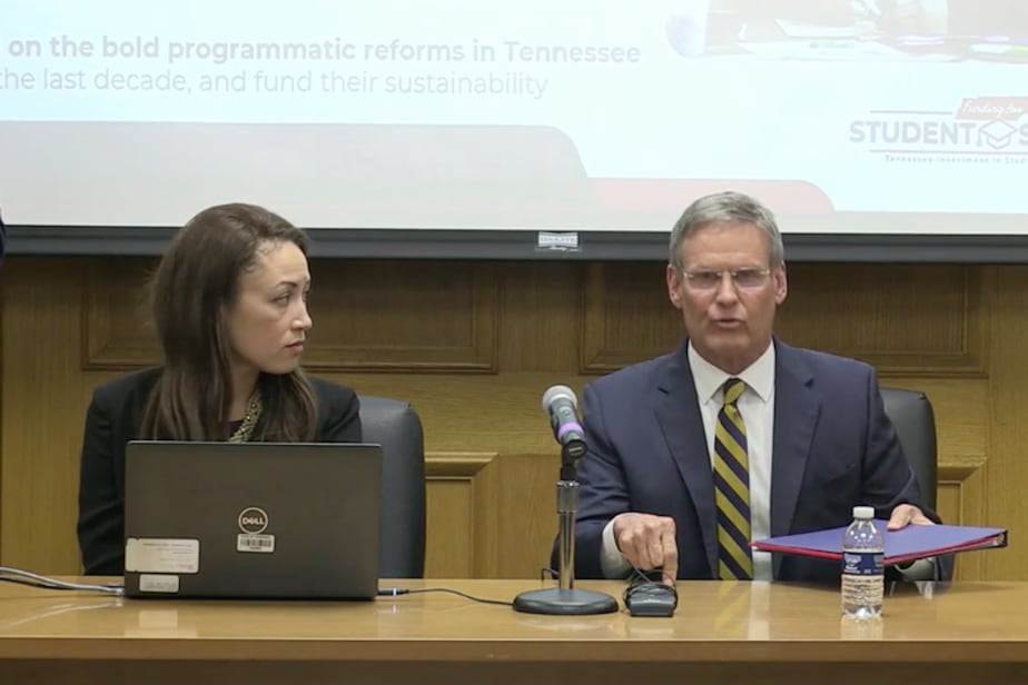Tennessee Education Commissioner Penny Schwinn looks at Gov. Bill Lee during a press conference.