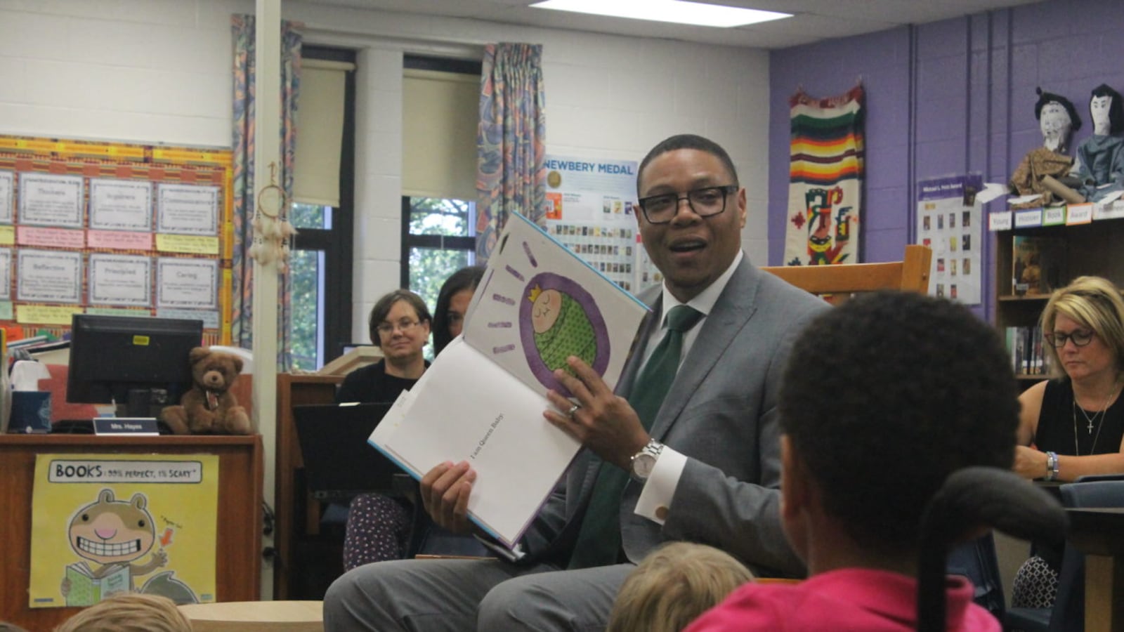 Superintendent Lewis Ferebee reads to children on the first day of school in 2017.