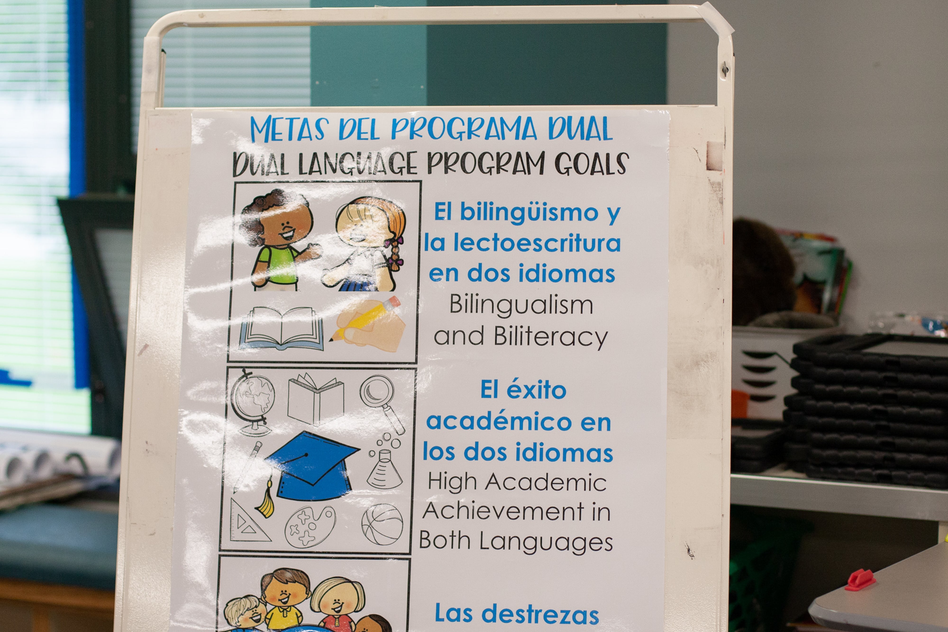 A sign in a bilingual classroom at Harrison Hill Elementary School explains the goals of the school’s dual language program. Some IPS parents want to see policies that would add more bilingual staff to schools in order to better allow families to engage in day-to-day communication.