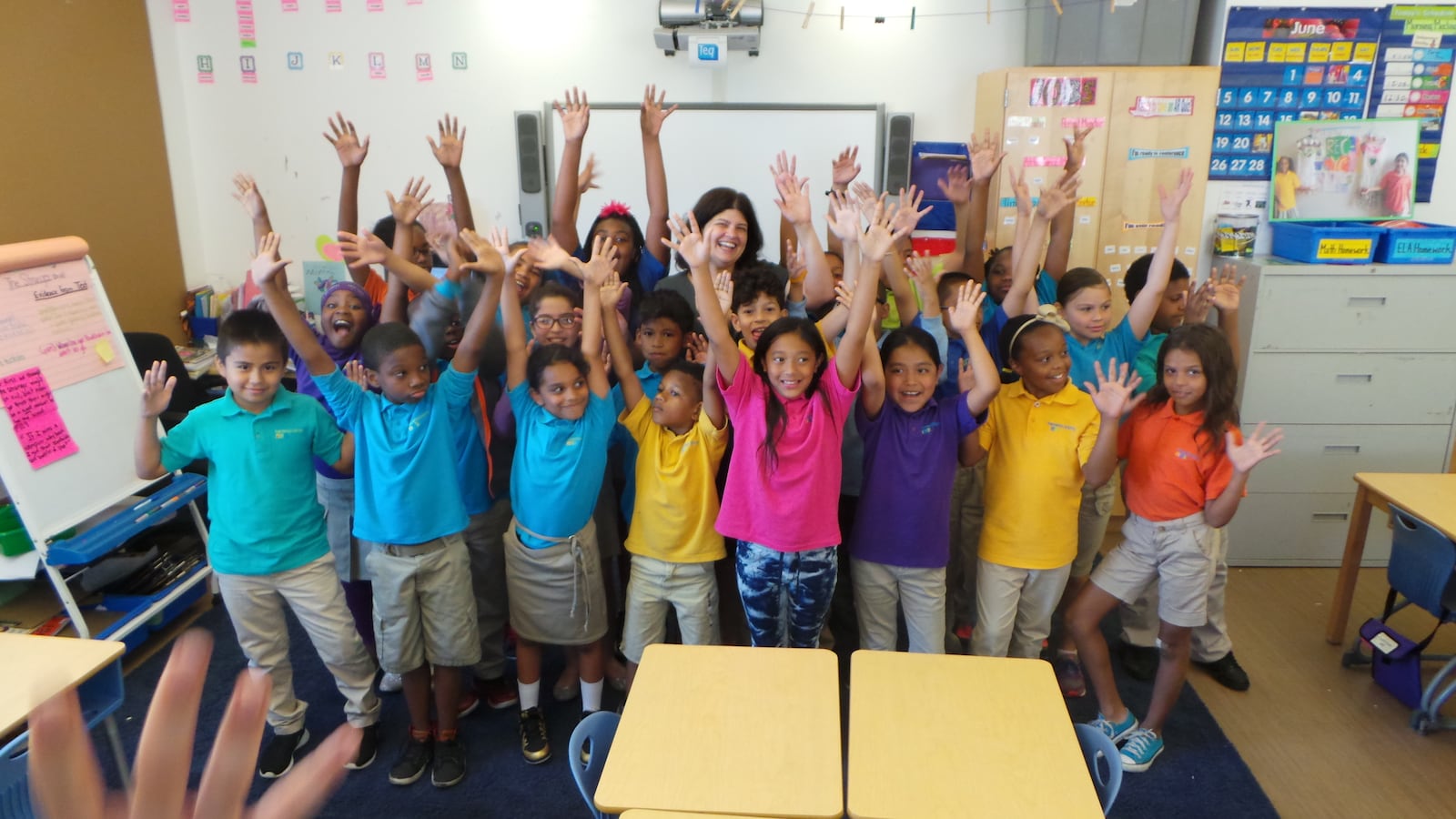 Principal Jessica Nauiokas with fourth-graders at Haven Academy.