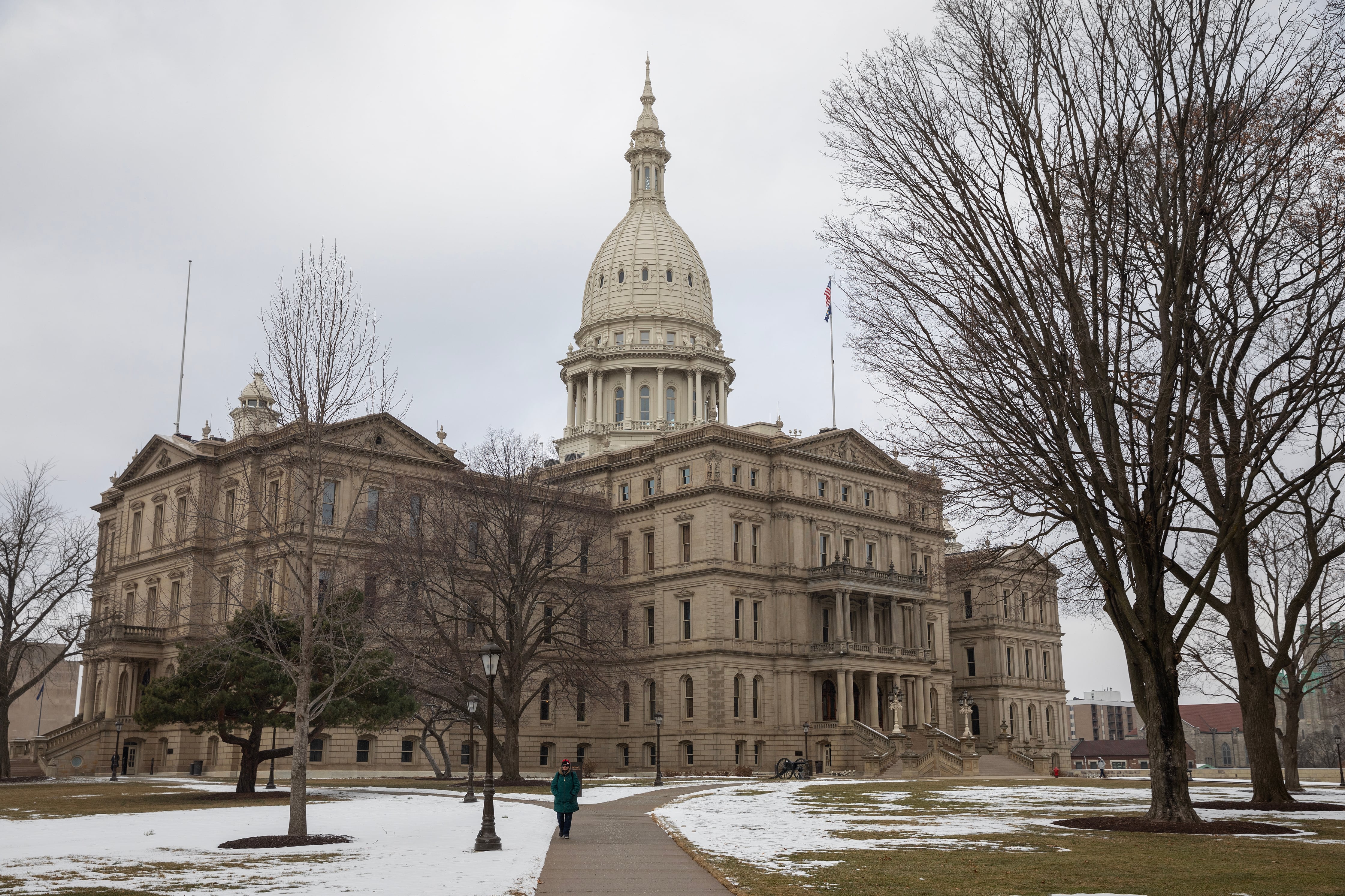 A large stone Capitol building on a cold, cloudy day.
