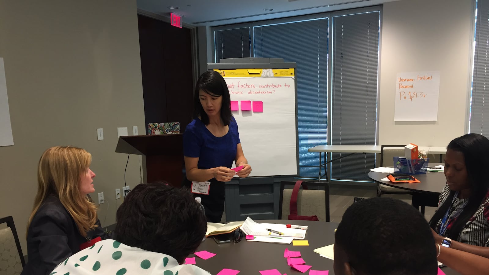 Shelby County Schools leaders brainstorm factors behind chronic absenteeism with a data analyst from Seeding Success.