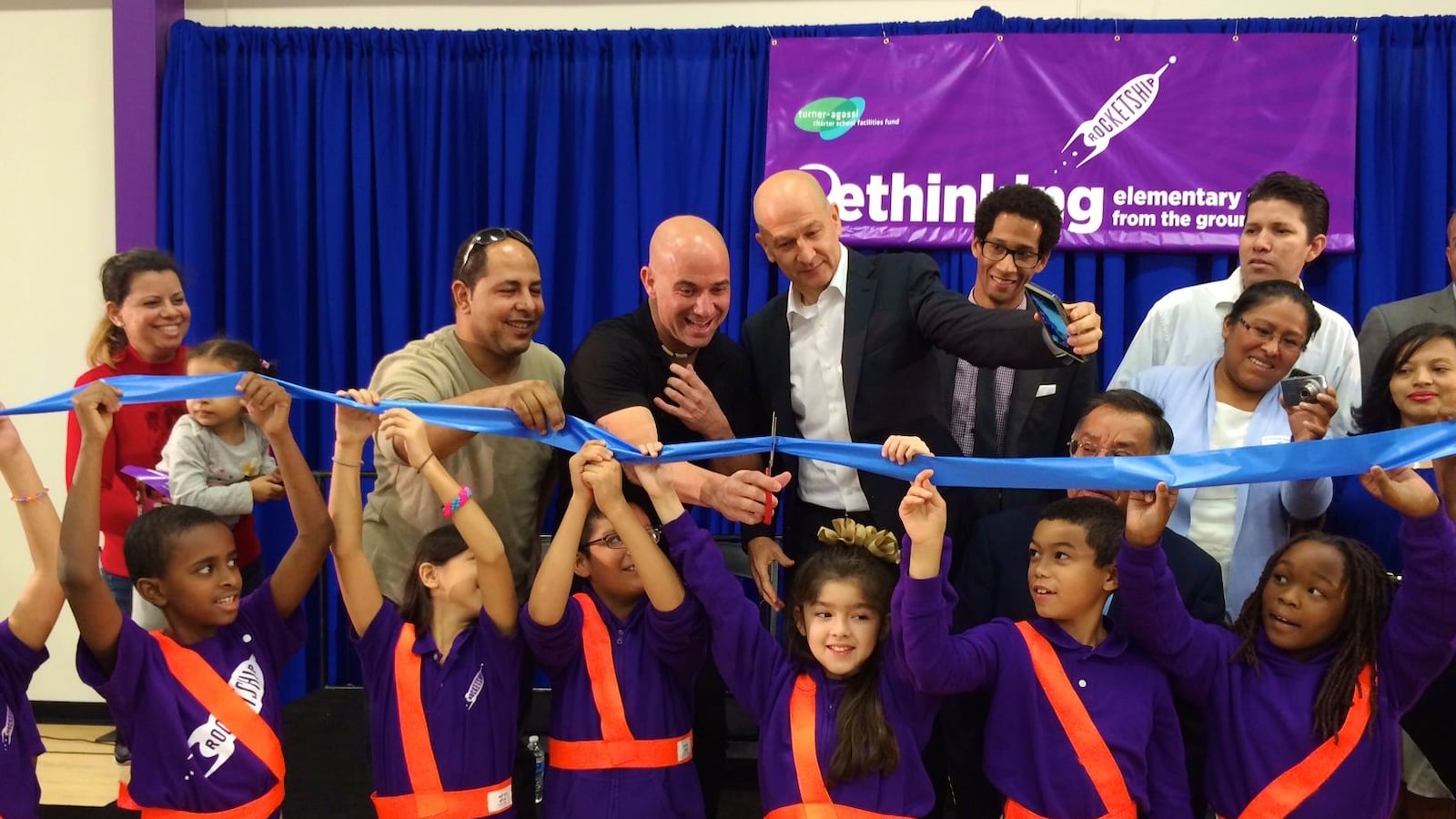Tennis great Andre Agassi cuts the ribbon as business partner Bobby Turner watches during the official opening last October of Rocketship's newest Nashville charter school.