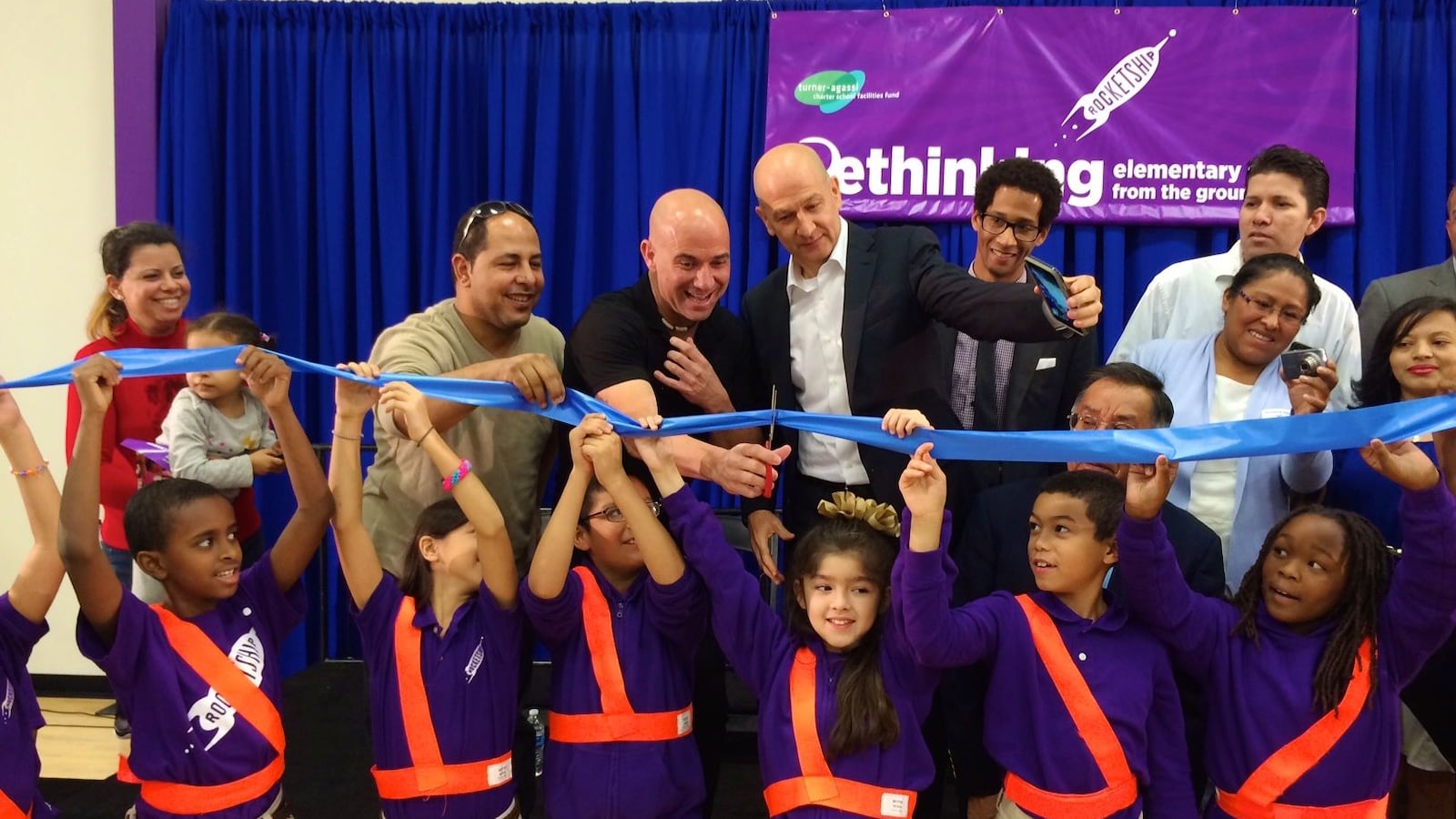 Tennis great Andre Agassi cuts the ribbon as business partner Bobby Turner watches during the official opening last October of Rocketship's newest Nashville charter school.