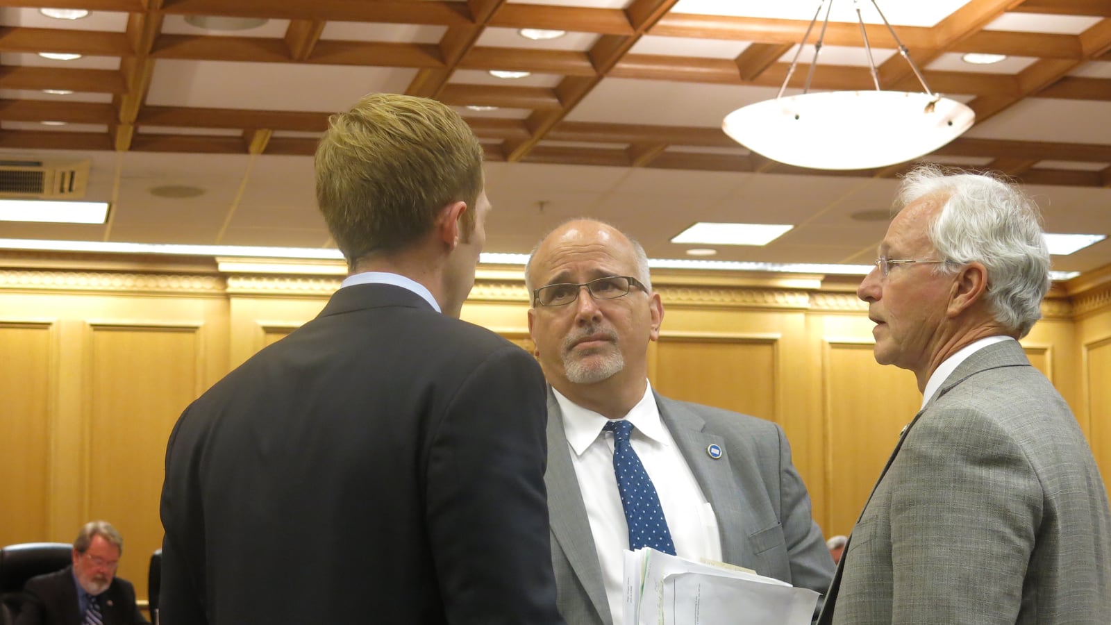 Rep. Roger Kane, a Republican from Knoxville and the co-sponsor of the "course access" bill, talks with policymakers Tuesday prior to a House Finance Committee meeting.