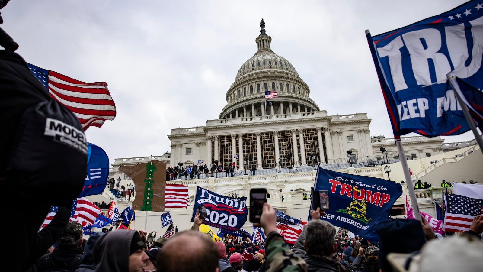 Rioters with Trump flags descend on the U.S. Capitol on January 6, 2021.