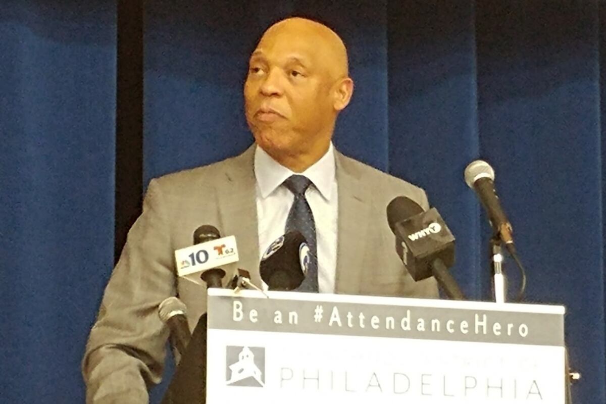 A man stands at a lectern