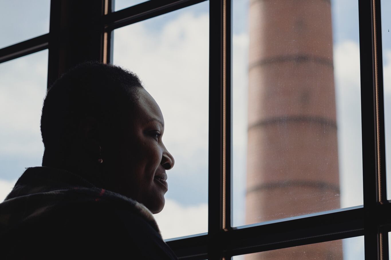 Purdue Polytechnic High School Principal Shatoya Ward looks out a window.