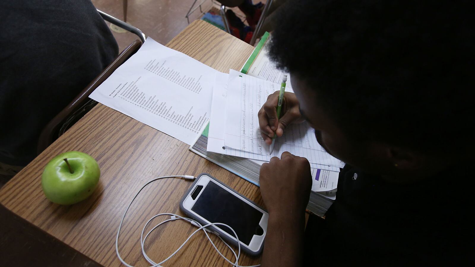 A student works at a desk in a classroom at Hillcrest High School in Memphis – one of five high schools in the Achievement School District.