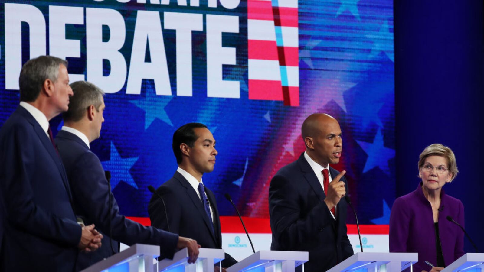 MIAMI, FLORIDA - JUNE 26: (L-R) New York City Mayor Bill De Blasio, Rep. Tim Ryan (D-OH), former housing secretary Julian Castro, Sen. Cory Booker (D-NJ) and Sen. Elizabeth Warren (D-MA) take part in the first night of the Democratic presidential debate on June 26, 2019 in Miami, Florida.