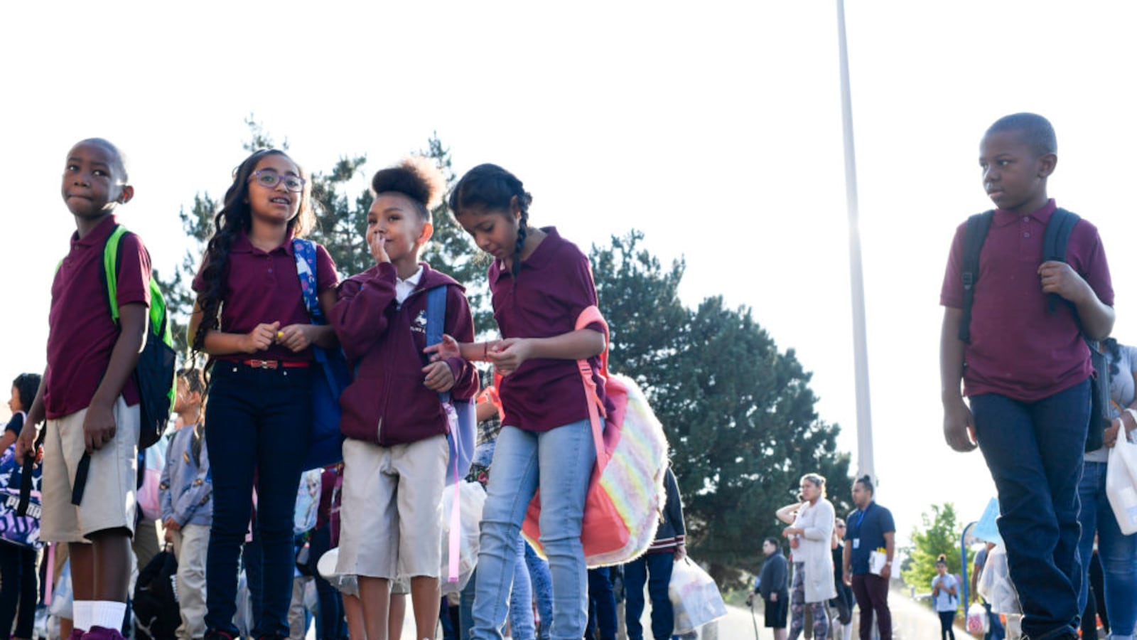 Students wait for the bell to ring on the first day of school at McGlone Academy on Wednesday. (Photo by AAron Ontiveroz/The Denver Post)