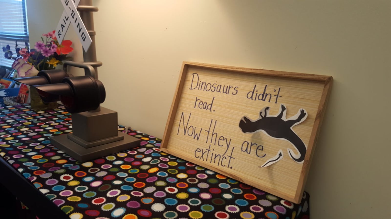 A frame above a bookcase in a fifth grade classroom in Aurora.