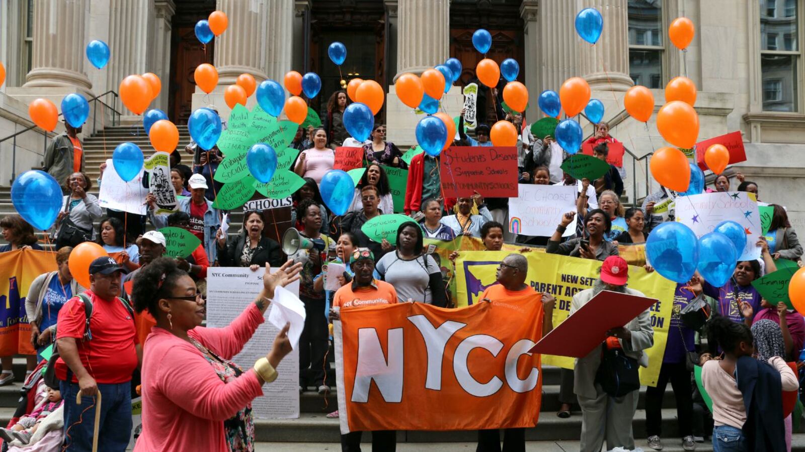 Community school proponents rallied in front of education department headquarters Tuesday.