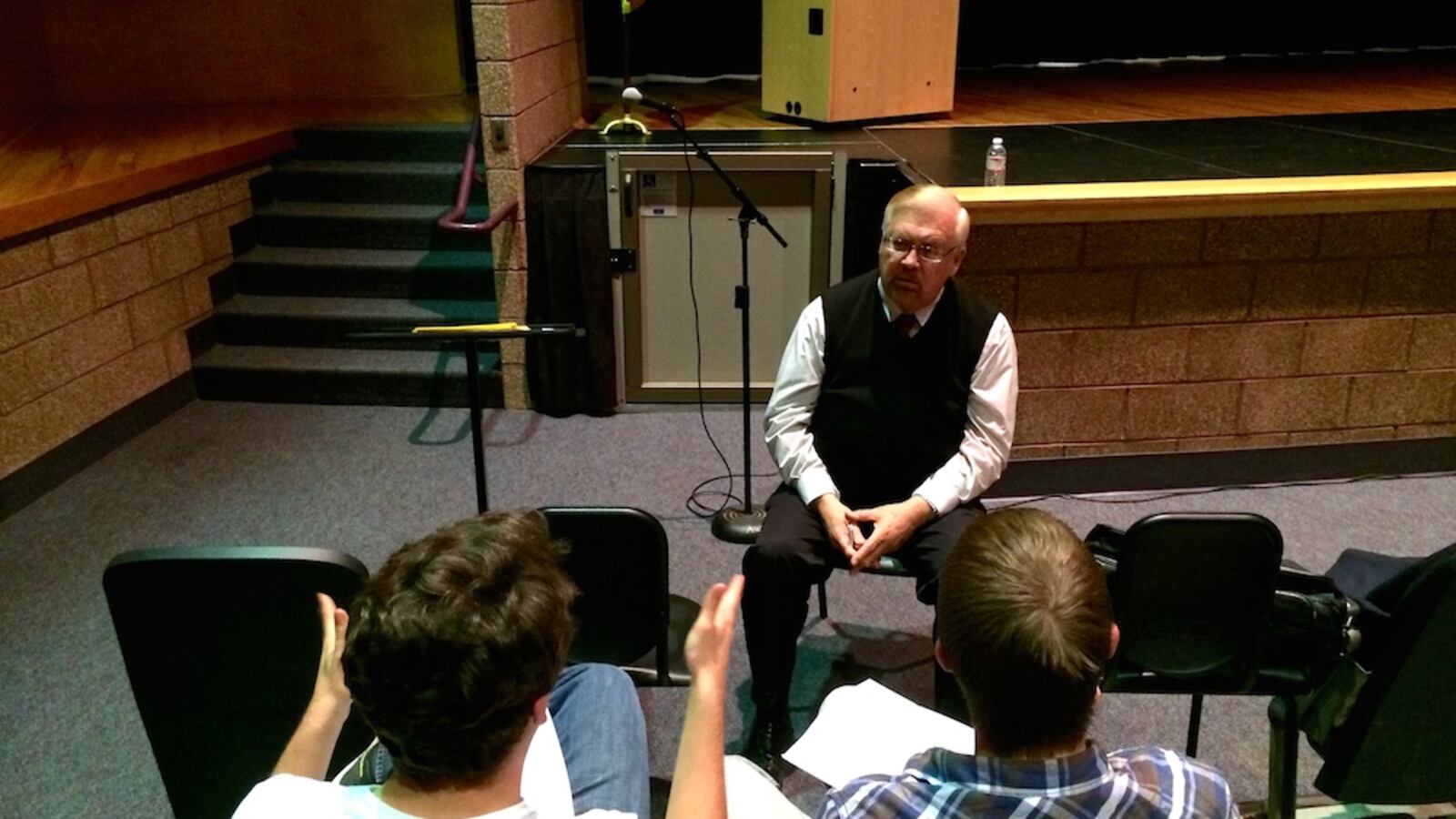 Bill Newman, center, of Ray and Associates, Inc., is helping lead the search for a new superintendent for Jeffco Public Schools. He spoke with Jeffco students Alex Kacsh, left, and Brandon Murphy at Arvada West High School Wednesday, March  19.