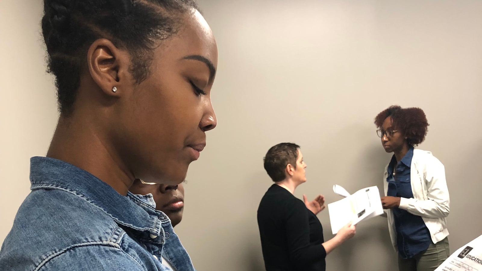 New Craigmont Middle School teacher Paige Williams looks over material on classroom management during a two-day Shelby County Schools orientation event on Aug. 1, 2019.
