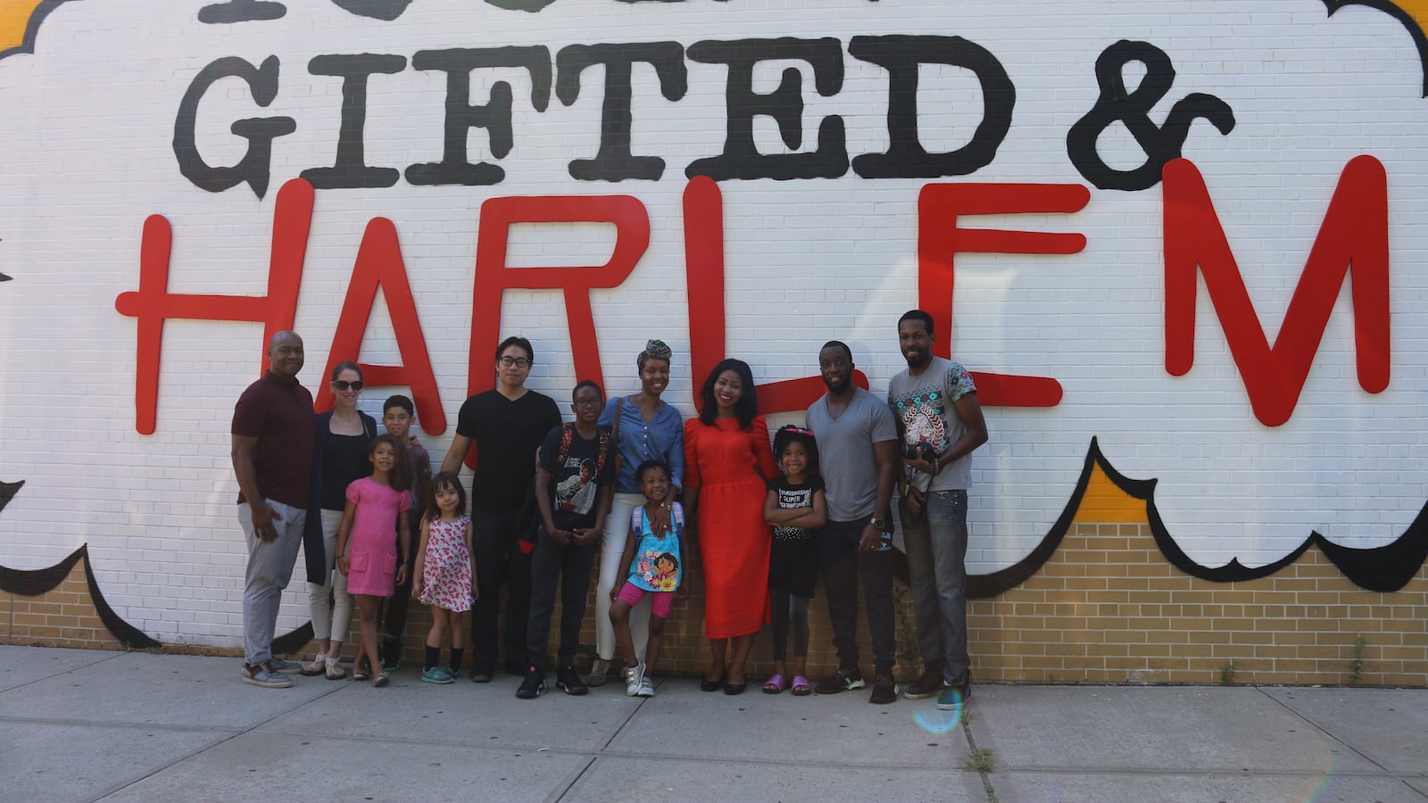 Genisha Metcalf, center right, and Dennis Morgan, far left, are among the parents at P.S. 180 who are leading a grassroots effort to boost Harlem schools.