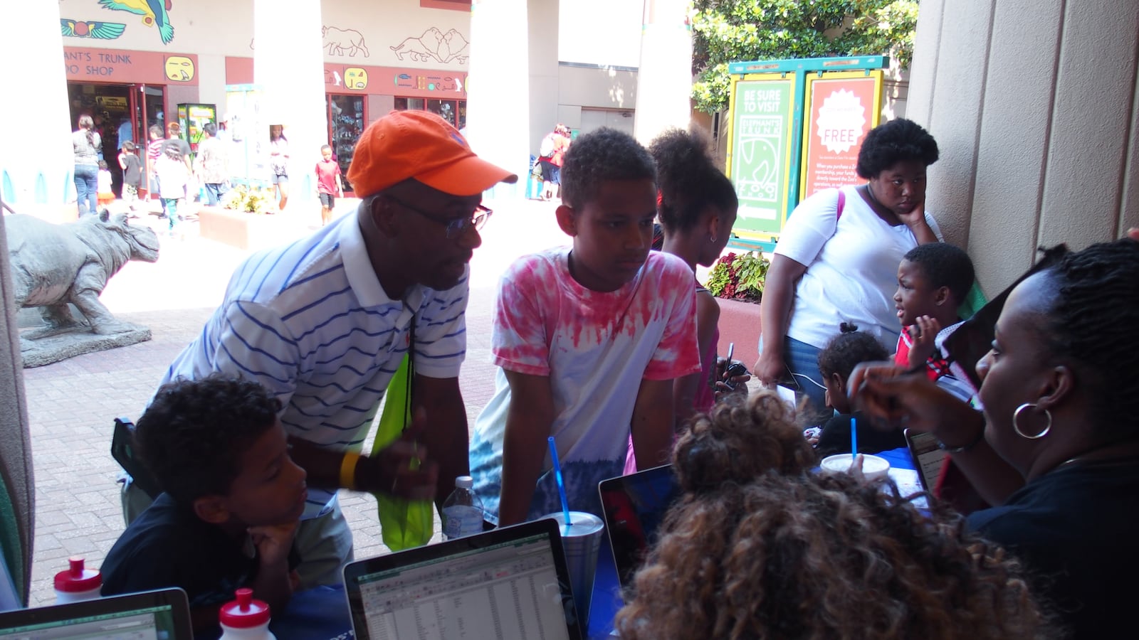 A family signs up students for the upcoming school year at a Shelby County Schools registration event at the Memphis Zoo.