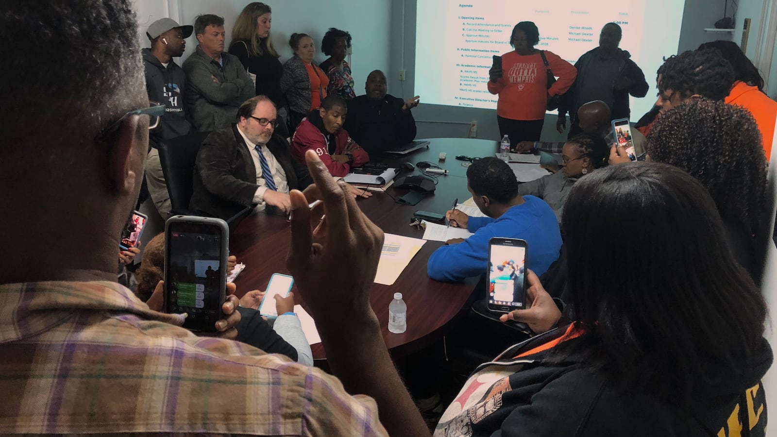 About 20 parents and parent supporters crowded a conference room at Memphis Academy of Health Sciences to demand answers about the high school principal's abrupt departure.