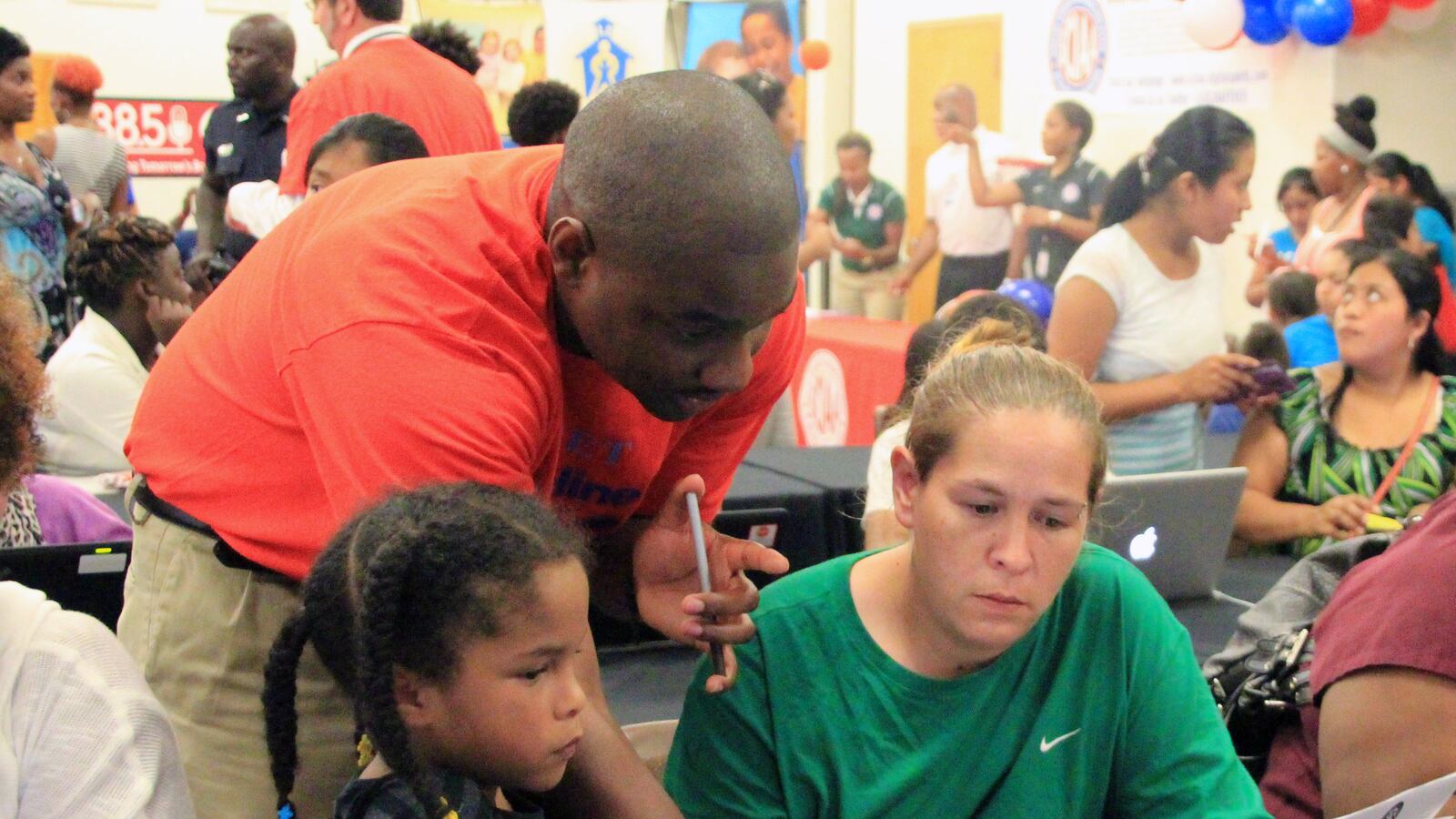 District employee Brandon Pinson works with Samantha Parks.