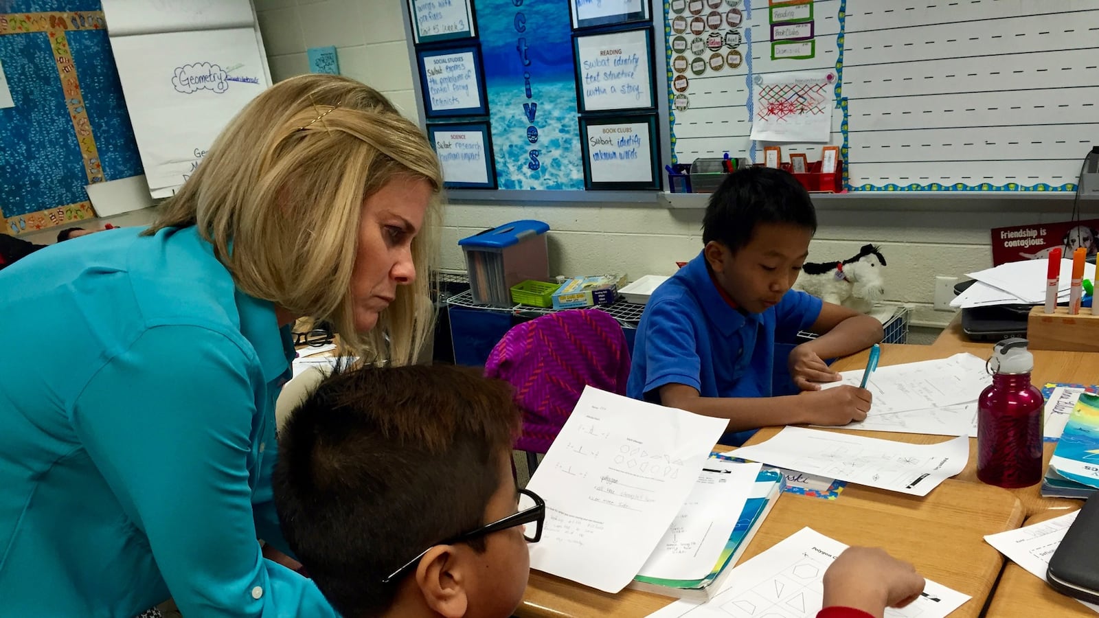 Angie Kendall, a master teacher at Southport Elementary School, works with a student. The school received an A from the state this year.