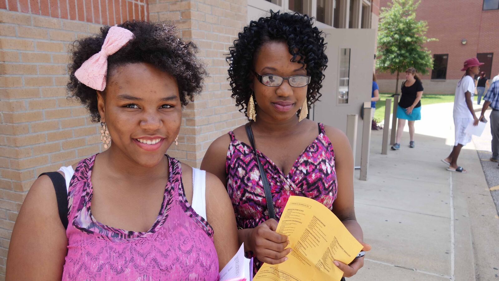 Makayla and Sherlisa McKay registered for classes at Millington High School today. Leaders of the six suburban districts said registration day was more important than ever this year.