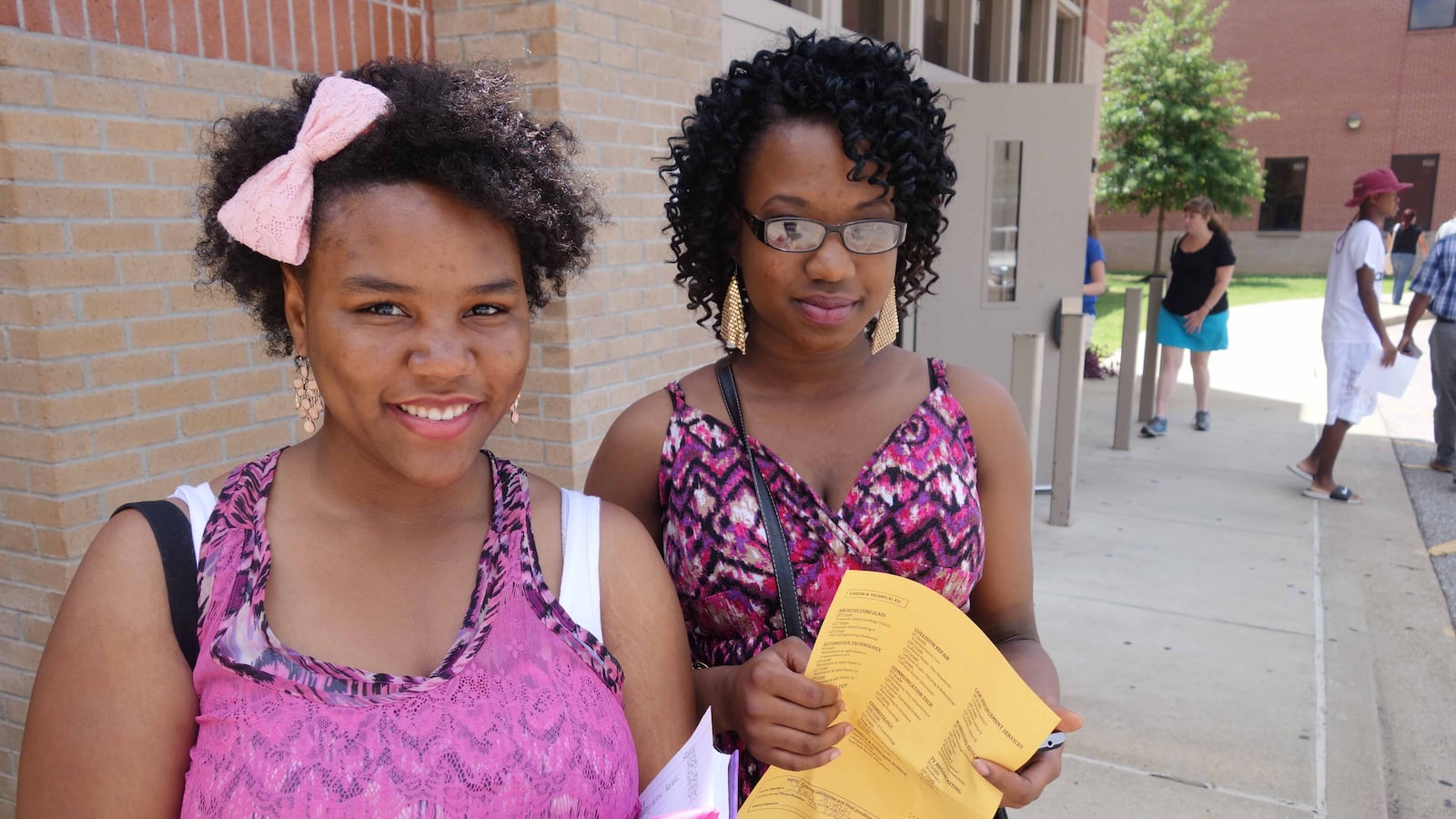 Makayla and Sherlisa McKay registered for classes at Millington High School today. Leaders of the six suburban districts said registration day was more important than ever this year.