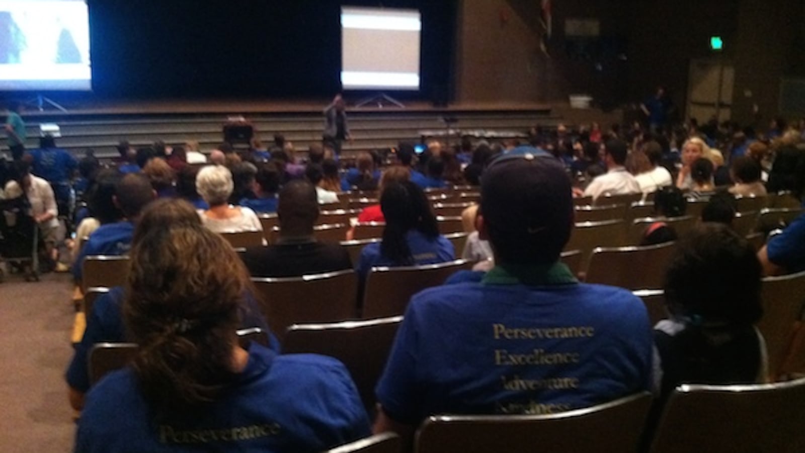 The blue t-shirts of Rocky Mountain Prep dominate the Hampden Heights community meeting.